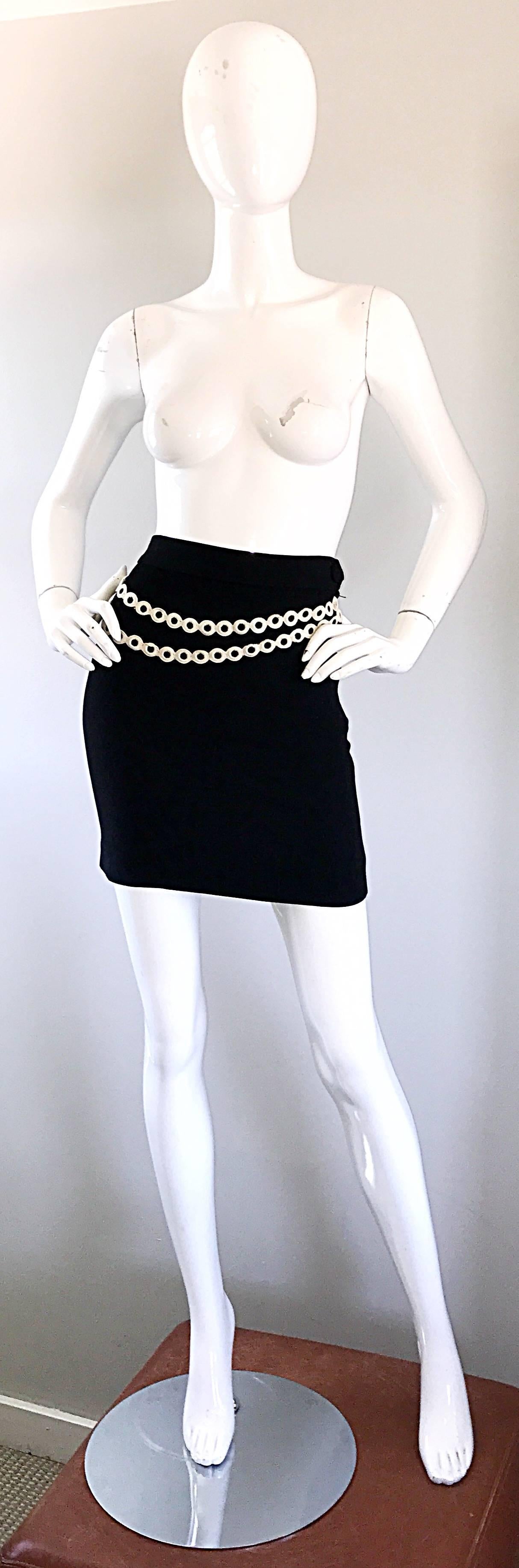 Sexy 90s MOSCHINO CHEAP AND CHIC black and white trompe l'oeil high waisted mini skirt! Black form fitting rayon crepe material with white embroidery on the front to look like a chain belt. Fully lined. Hidden zipper up the side with 
hook-and-eye