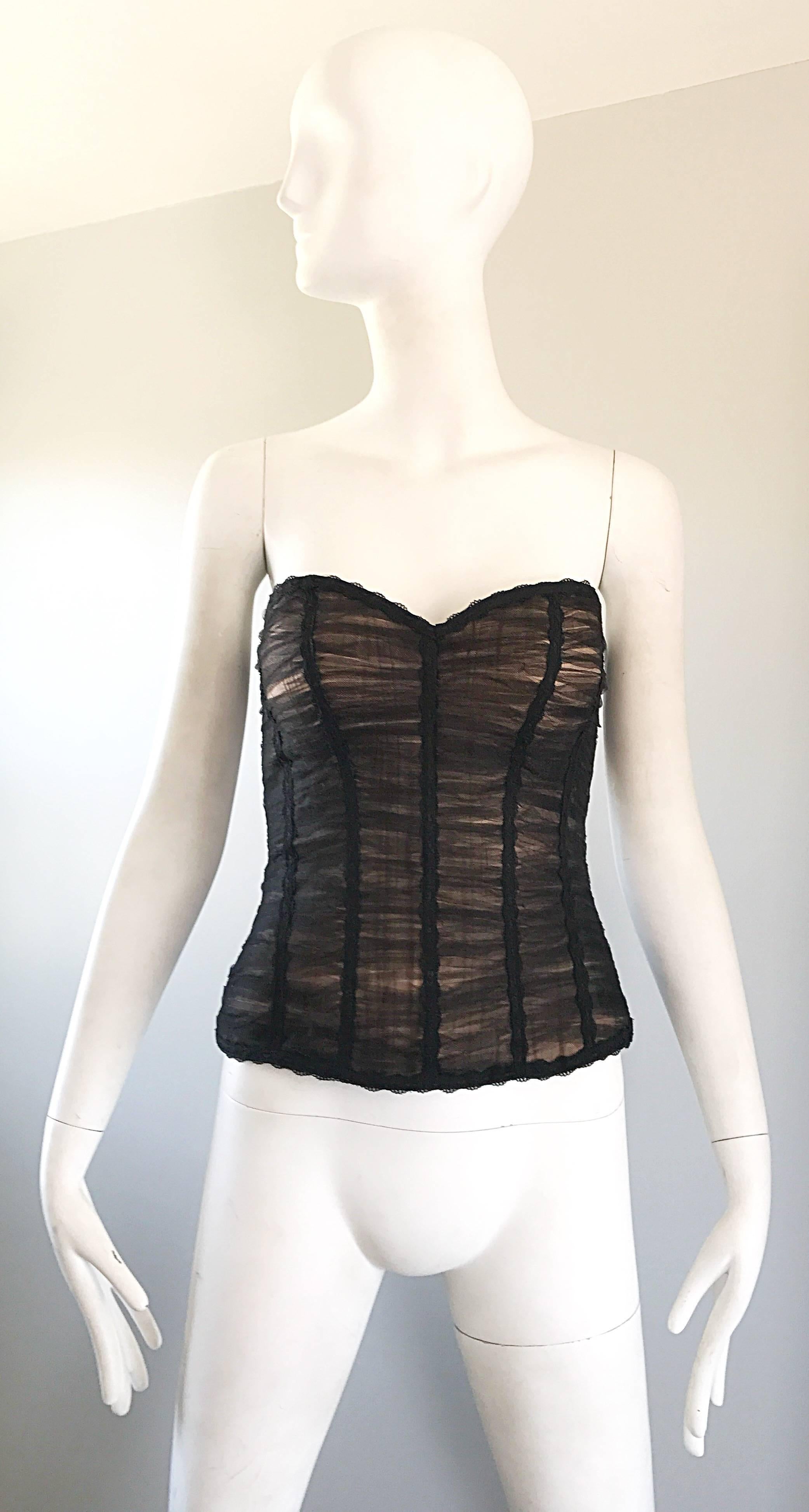 Gorgeous and sexy new RENE RUIZ black and nude strapless silk ruched bustier / corset! Features a nude silk backdrop, with a black net ruched overlay. Hidden zipper up the side with hook-and-eye closure. Inner boned bodice helps keep everything in