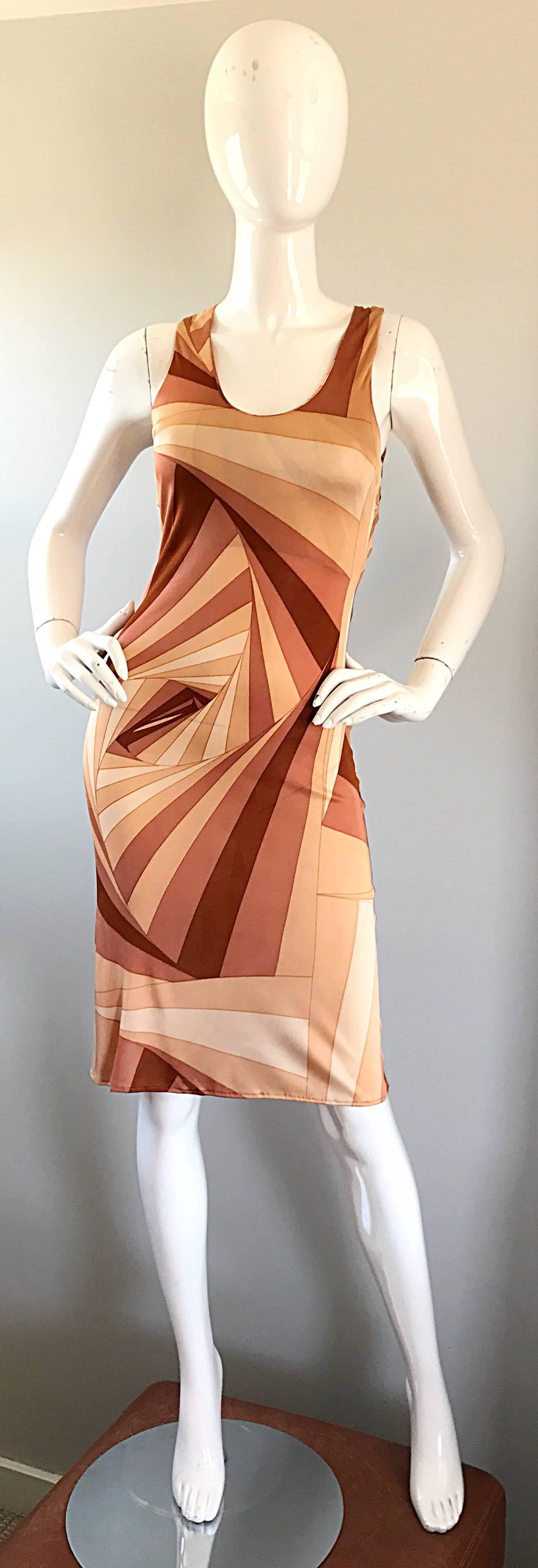 Sexy vintage GIANNI VERSACE Versus bodycon rayon jersey dress! Features warm tones of brown, tan, burgundy, and terra-cotta. 3-D geometric print throughout. Open criss-cross back, with hidden zipper up the side and hook-and-eye closure. Super