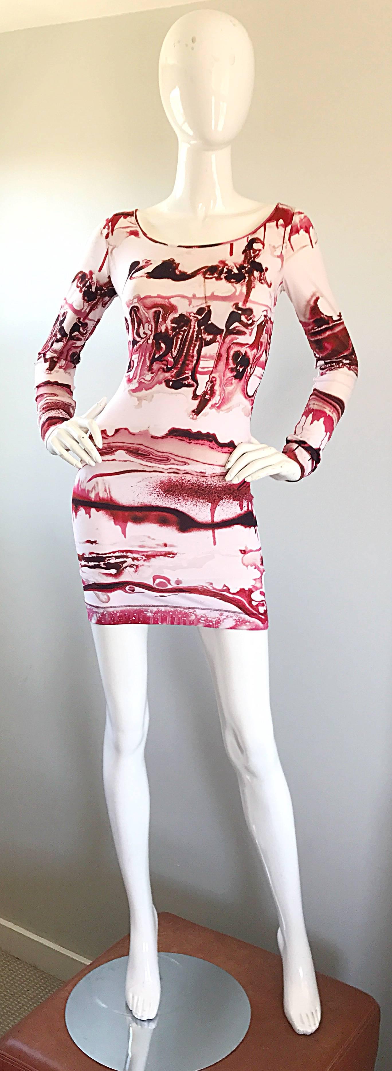 Rare vintage early 2000s JEAN PAUL GAULTIER vampire / blood theme graffiti mini dress. Super sought after print collection. Stretch rayon jersey will stretch to fit. Great belted or alone, with heels or boots. In great condition.
Made in