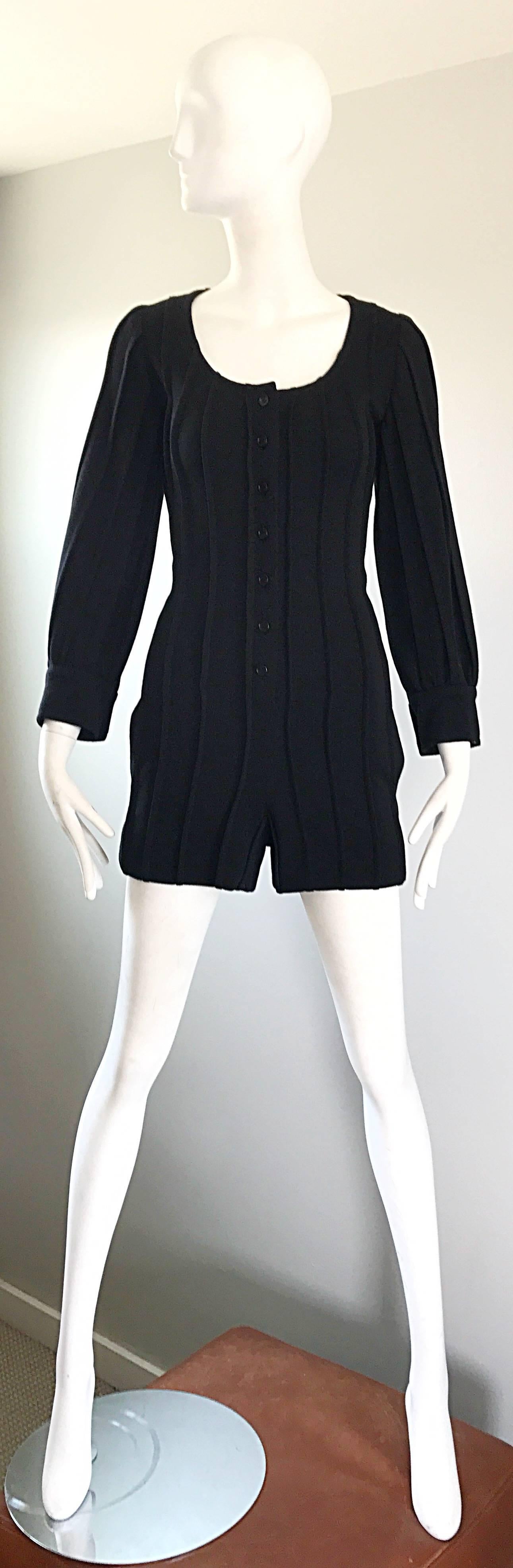 Incredible 1990s GIVENCHY HAUTE COUTURE by ALEXANDER MCQUEEN black ribbed wool romper onesie! Soft virgin wool features vertical ribs throughout. Buttons up the bodice, and at each sleeve cuff. Pocket at each side hip. Amazing quality, with an