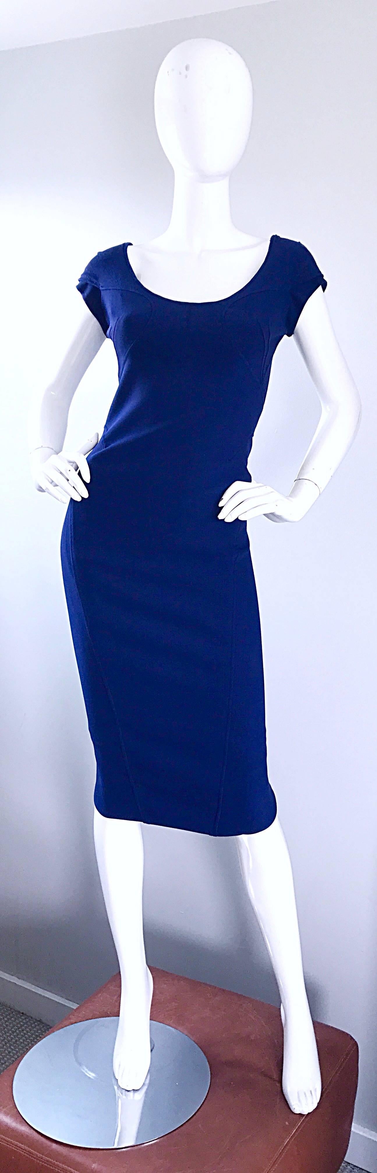 Flattering early 2000s ZAC POSEN navy blue bodcon dress! Signature stitching hides any 'problem' areas. Stretch virgin wool blend, and fully lined in silk. Tulip hem in th eback. Hidden zipper up th eback, with hook-and-eye closure. Great belted or