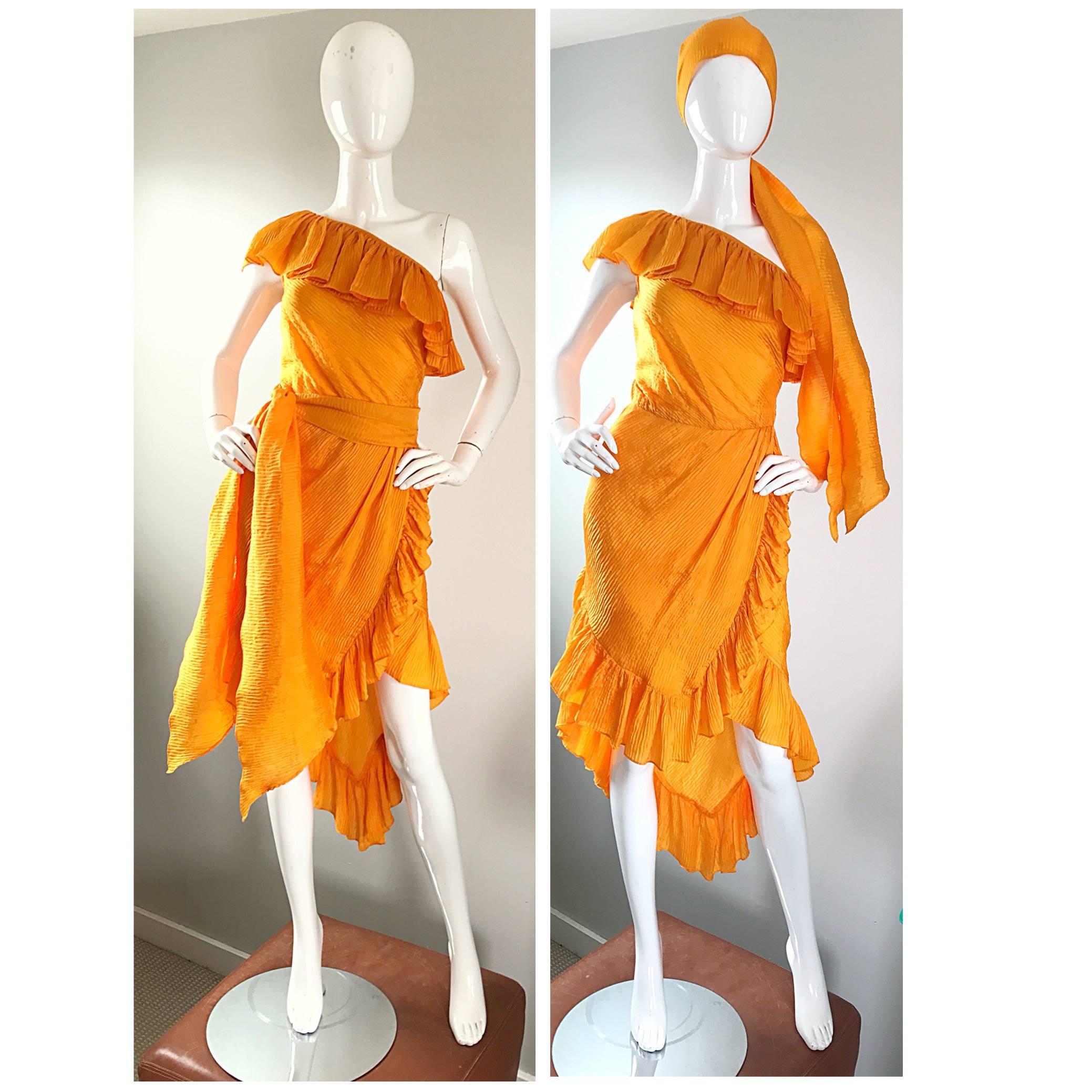 Rare late 70s vintage YSL Rive Gauche one shoulder silk tangerine marigold dress and sash! Luxurious silk plisse feels great against the skin. Features ruffles throughout, and the skirt has a handkerchief hem that is longer in the back. Would look