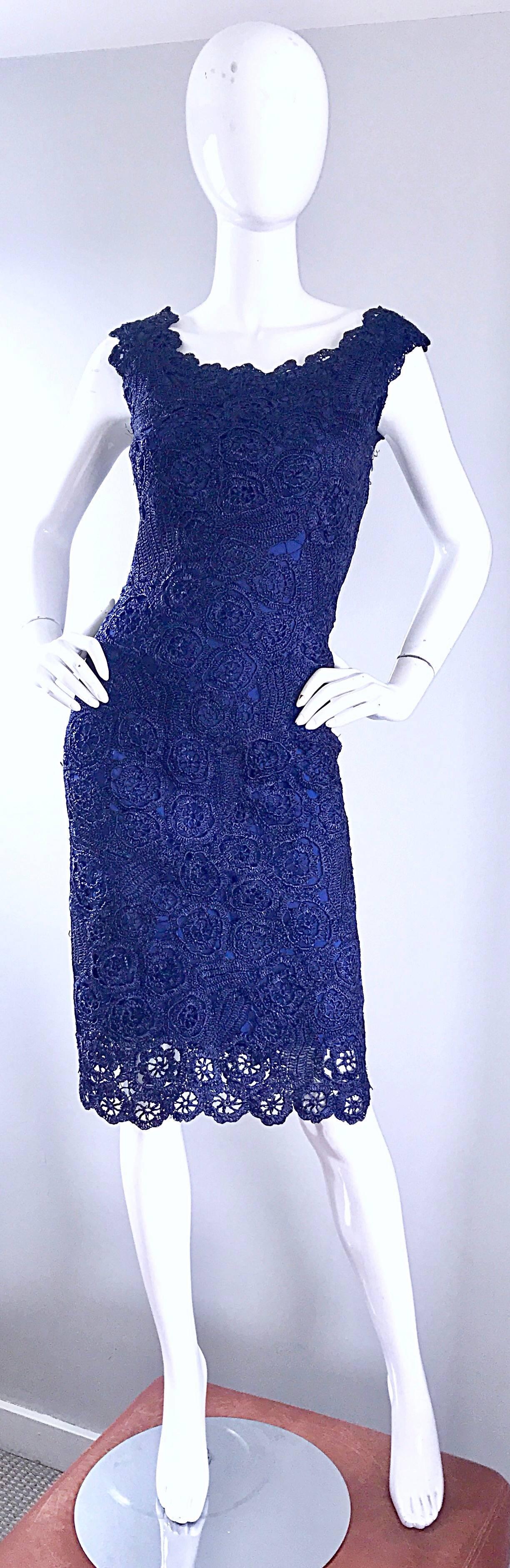 Smashing 1950s Demi Couture navy blue raffia dress! Vibrant navy blue raffia with an attached silk lining. Full metal zipper up the side with hook-and-eye closure. Bombshell fit, with a fitted bodice and cap sleeves. Extremely flattering fit that