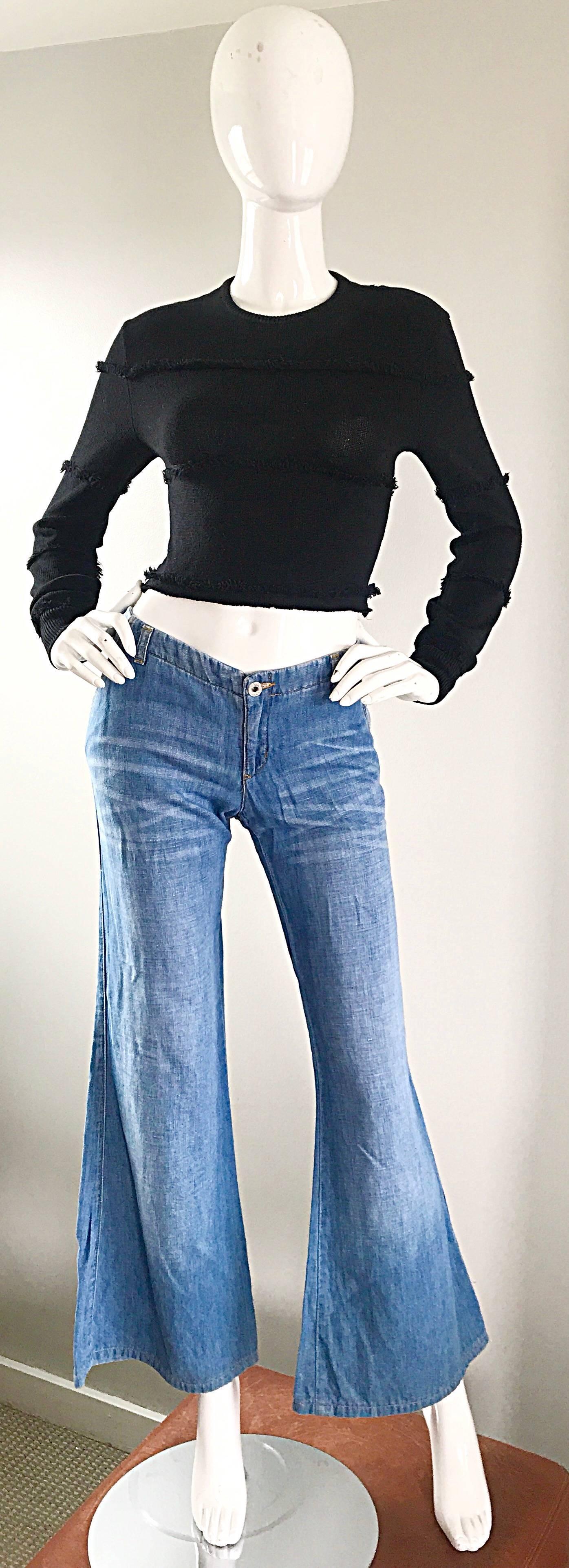 Awesome 90s does 70s MOSCHINO low rise flared leg medium wash boho denim! Super flattering fit, with an ultra chic and of-the-moment fit. Low rise sits nicely on the hips, with a fitted leg, and super wide hem. Strategically place 'whiskers' below