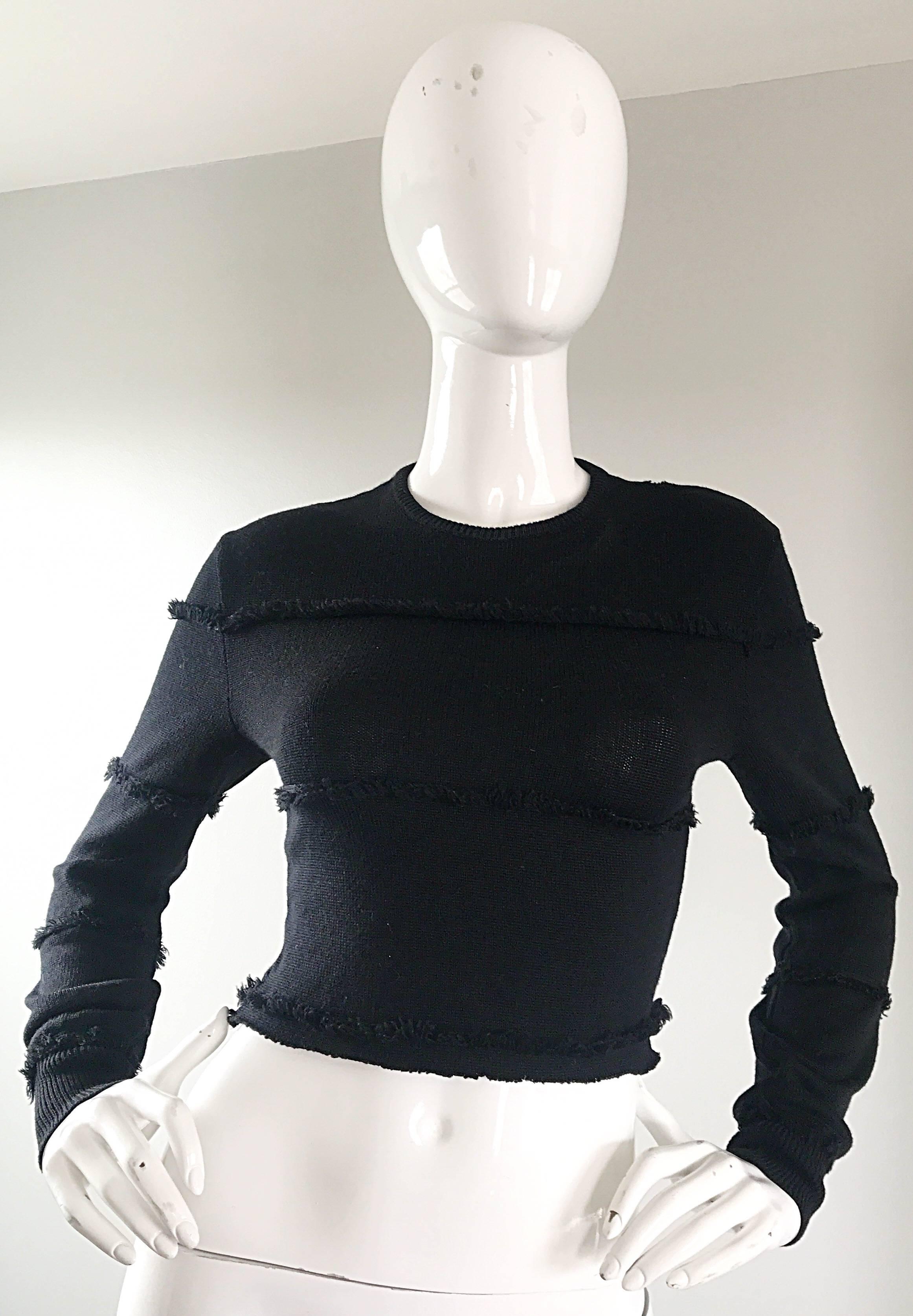 Rare early GIANNI VERSACE black cotton knit fringed cropped sweater top! Features lines of fringe throughout the entire garment. Sexy crop fit reveals just the right amount of skin. A truly versatile wardrobe staple. The pictures 90s MOSCHINO low