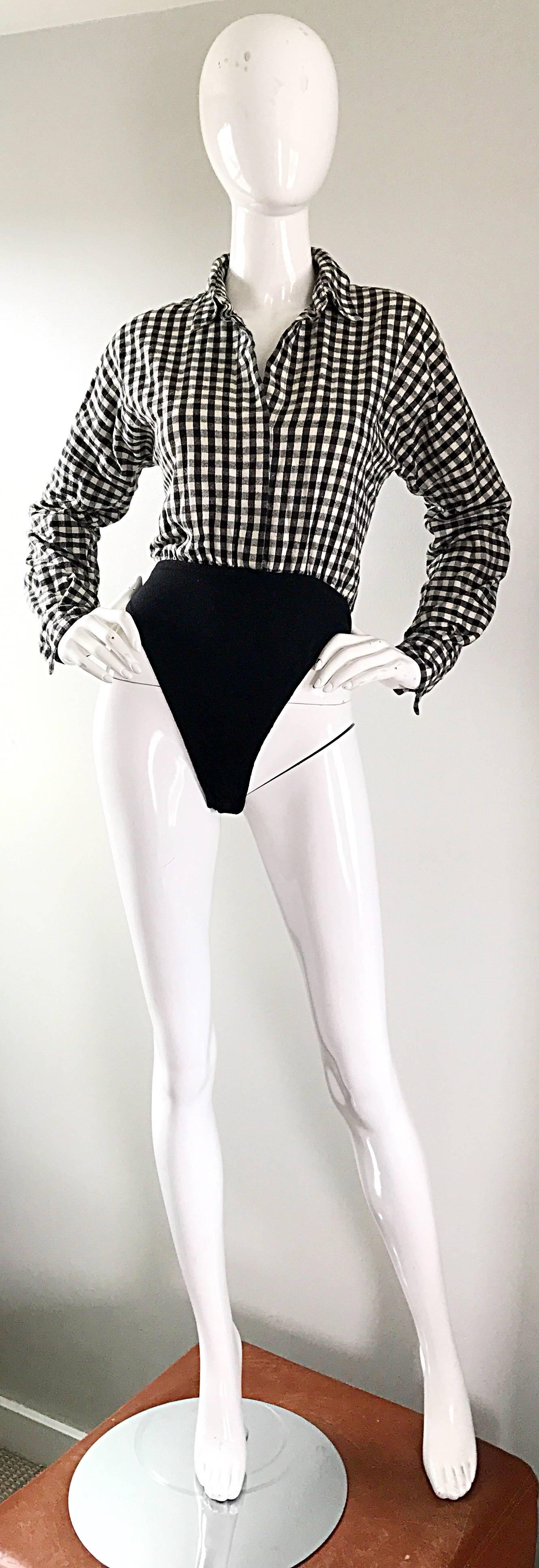Incredibly chic 90s NORMA KAMALI black and white checkered long sleeve bodysuit! Features a super soft luxurious cotton flannel dolman sleeve bodice. Hidden buttons up the front. Elastic waist stretches to fit. Buttons also at each sleeve cuff. Can