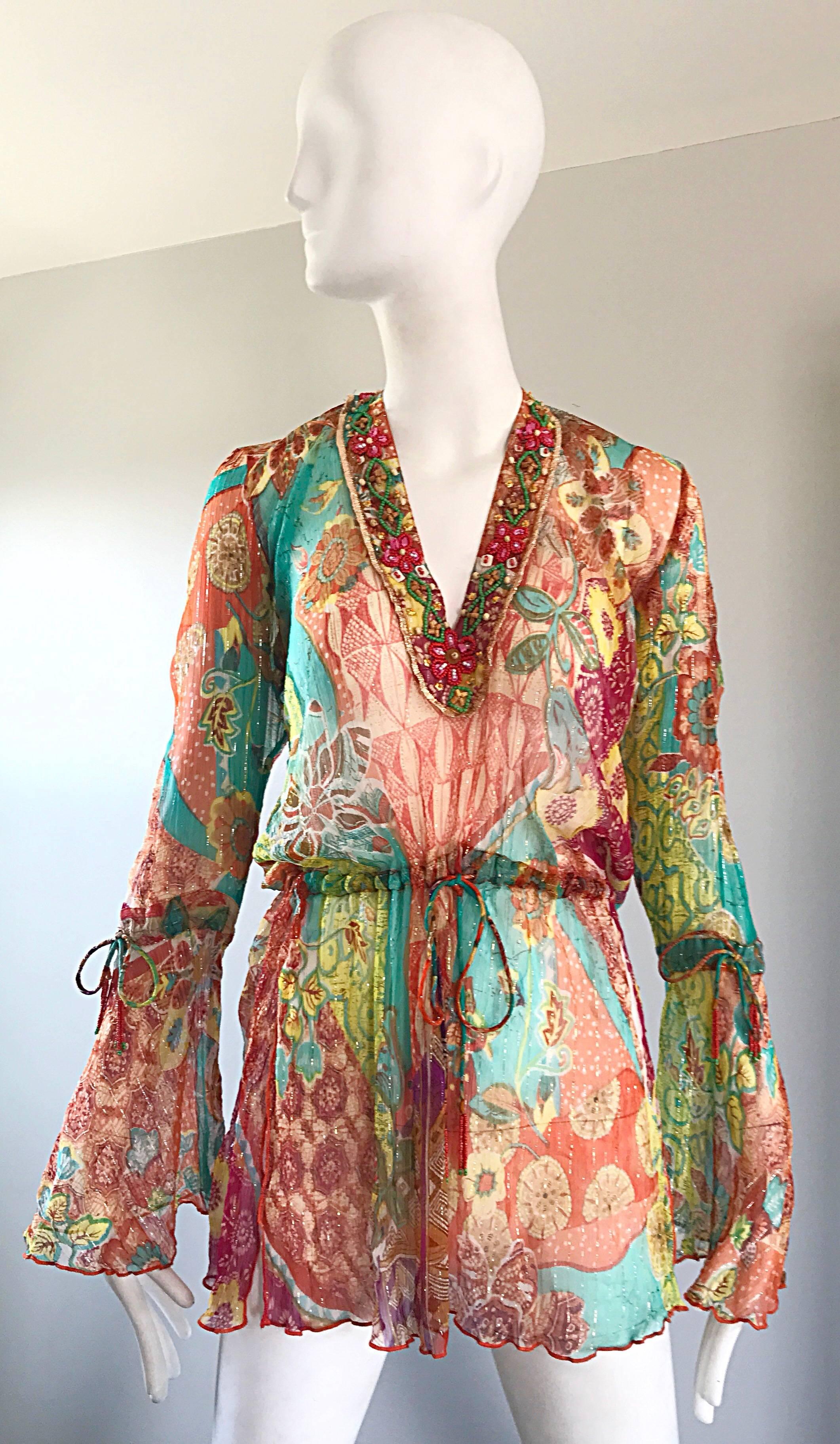 Stunning Vintage 1990s MAURIZIA BYOUX colorful mixed patterned silk chiffon Italian tunic blouse! Features beadwork along the neckline. Bell sleeves have ties below each elbow, at waist, and at top back neck. Side slit at each hip. Can be worn