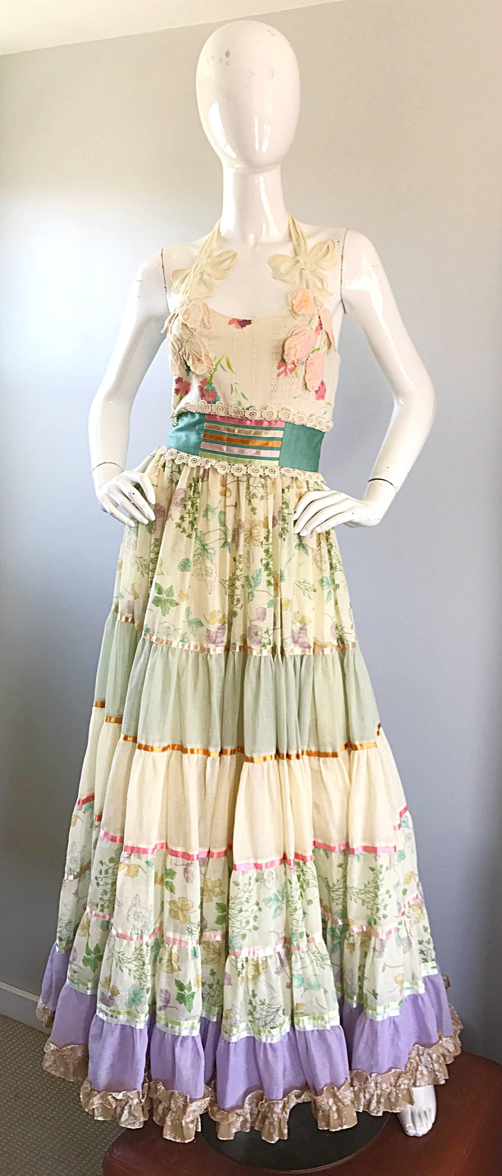 Gorgeous and rare early 1970s GIORGIO DI 'SANT ANGELO boho halter maxi dress! Features colorful floral prints throughout. Layers and layer of soft cotton voile provide great movement. Fitted bodice with a full skirt. Embroidered flower and ribbon