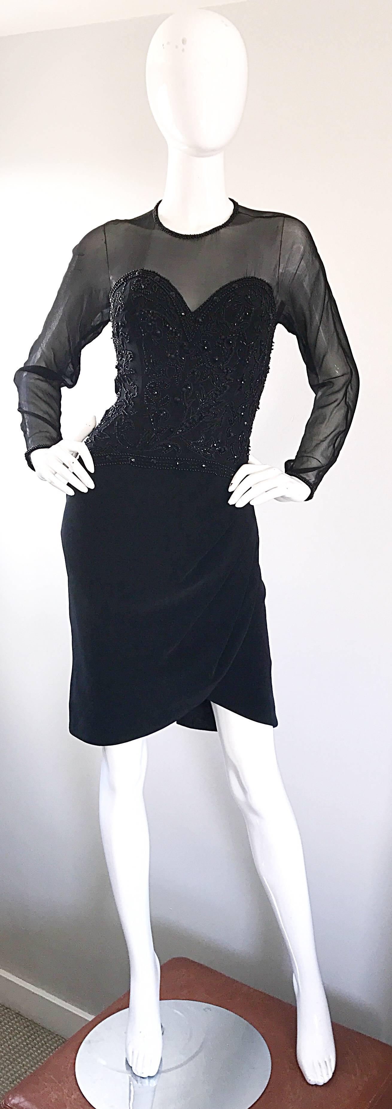 Sexy 1990s black beaded bodcon nude illusion mini dress! Features a fully beaded fitted corset bodice, with thousands of hand-sewn black beads throughout the front and back. Black sheer mesh around the neck and long sleeves. Beads around the neck