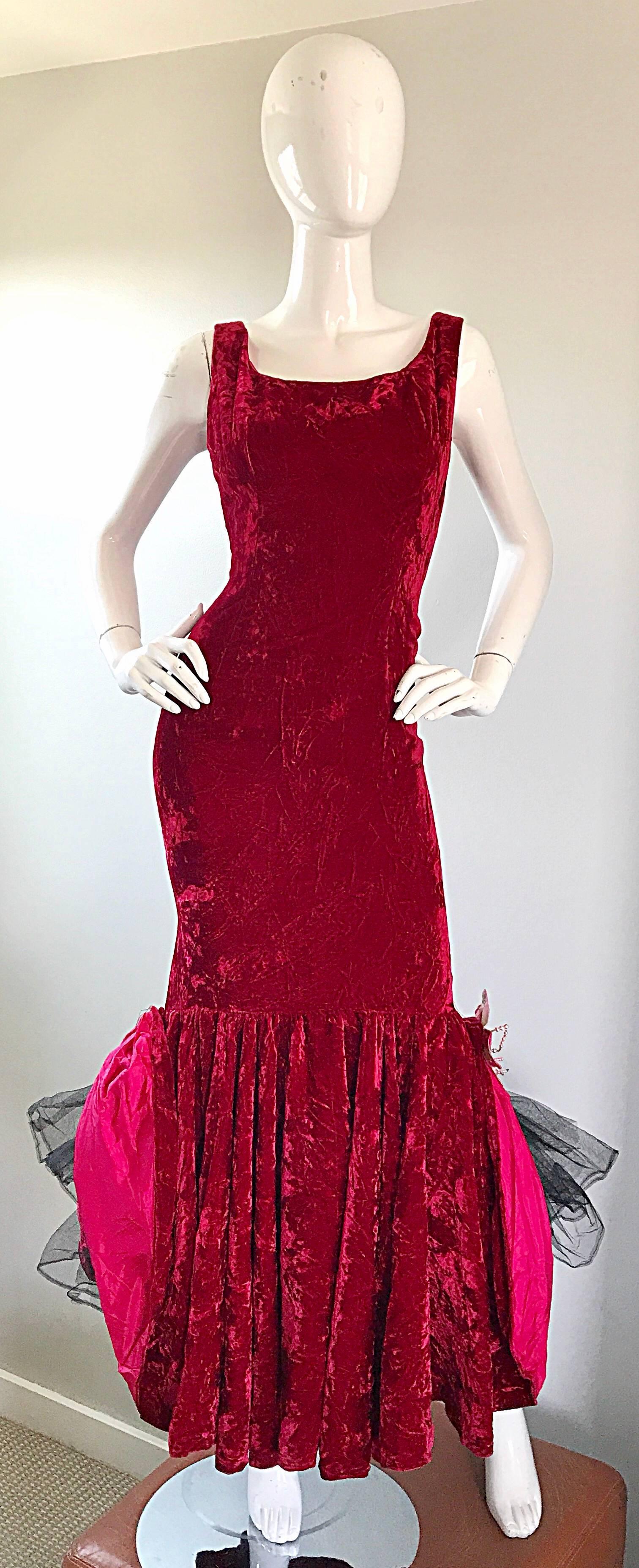 Sensational 50s demi couture crimson red crushed velvet full length mermaid evening dress! Features luxurious crushed silk velvet, with a form fitting bodice and skirt. Dramatic flared hem features a built in black crinoline underneath. Velvet is