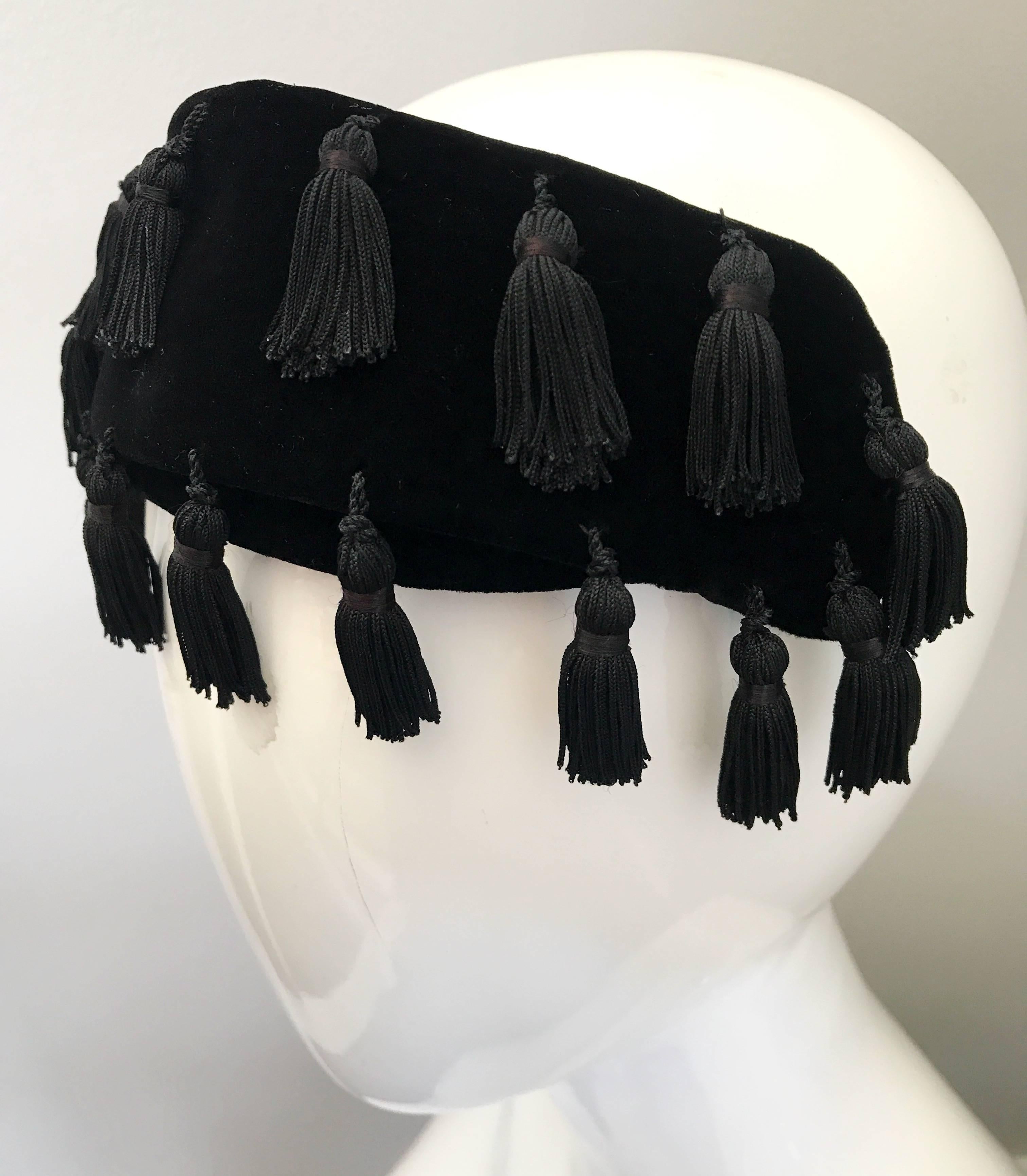 This 1950s NEIMAN MARCUS half hat fascinator is the perfect addition to an outfit! Black velvet, with about 20 tassels hand-sewn throughout. Can also be worn as a headband. Perfect with a dress, jeans, or a gown. Stretches to fit all head sizes. In