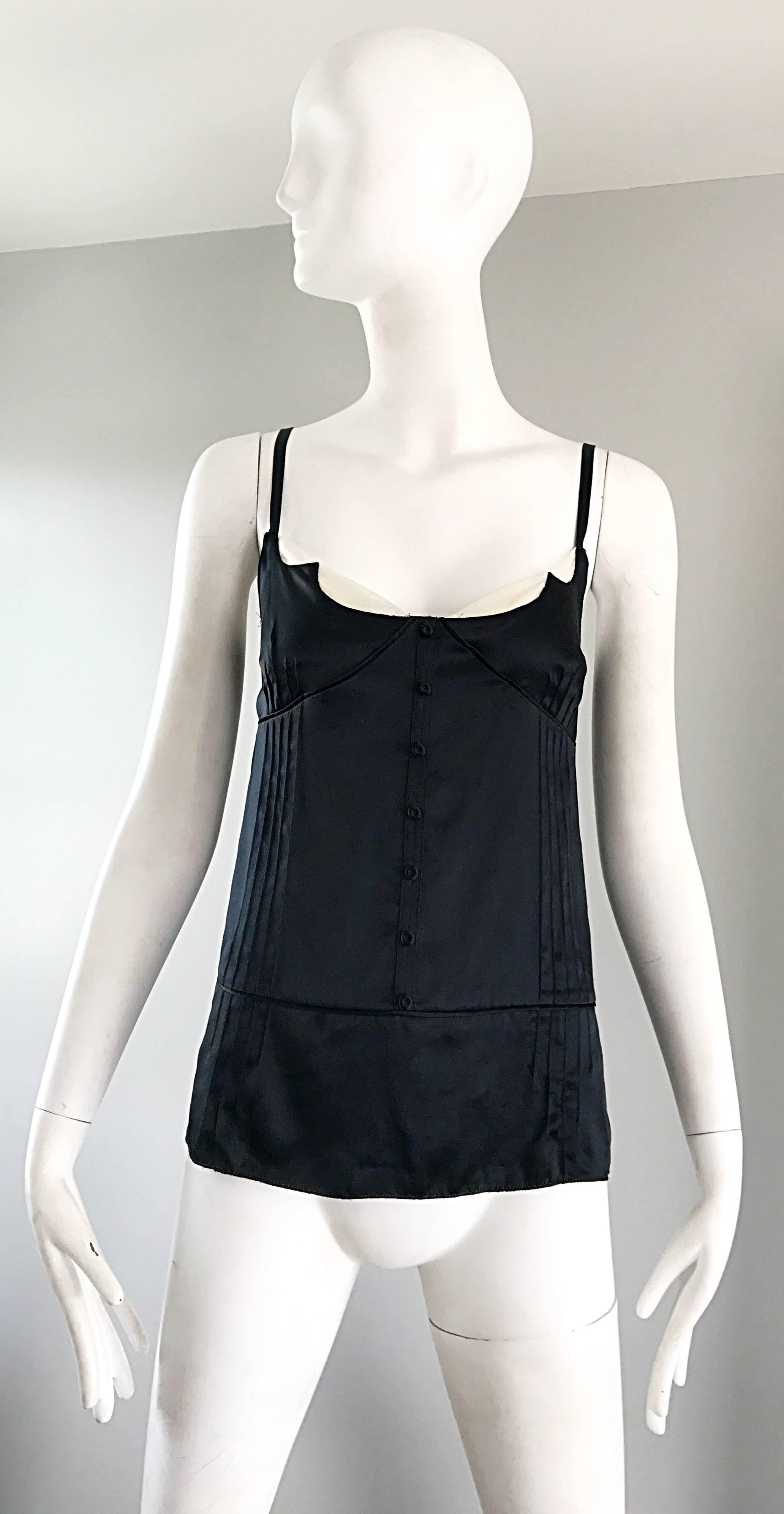 Chic MARC JACOBS black and white silk camisole tuxedo top! Resembles a tuxedo, with seven mock buttons up the front. Angular cut bust with white silk under. Hidden zipper up the side with hook-and-eye closure. Adjustable sleeve straps can be made