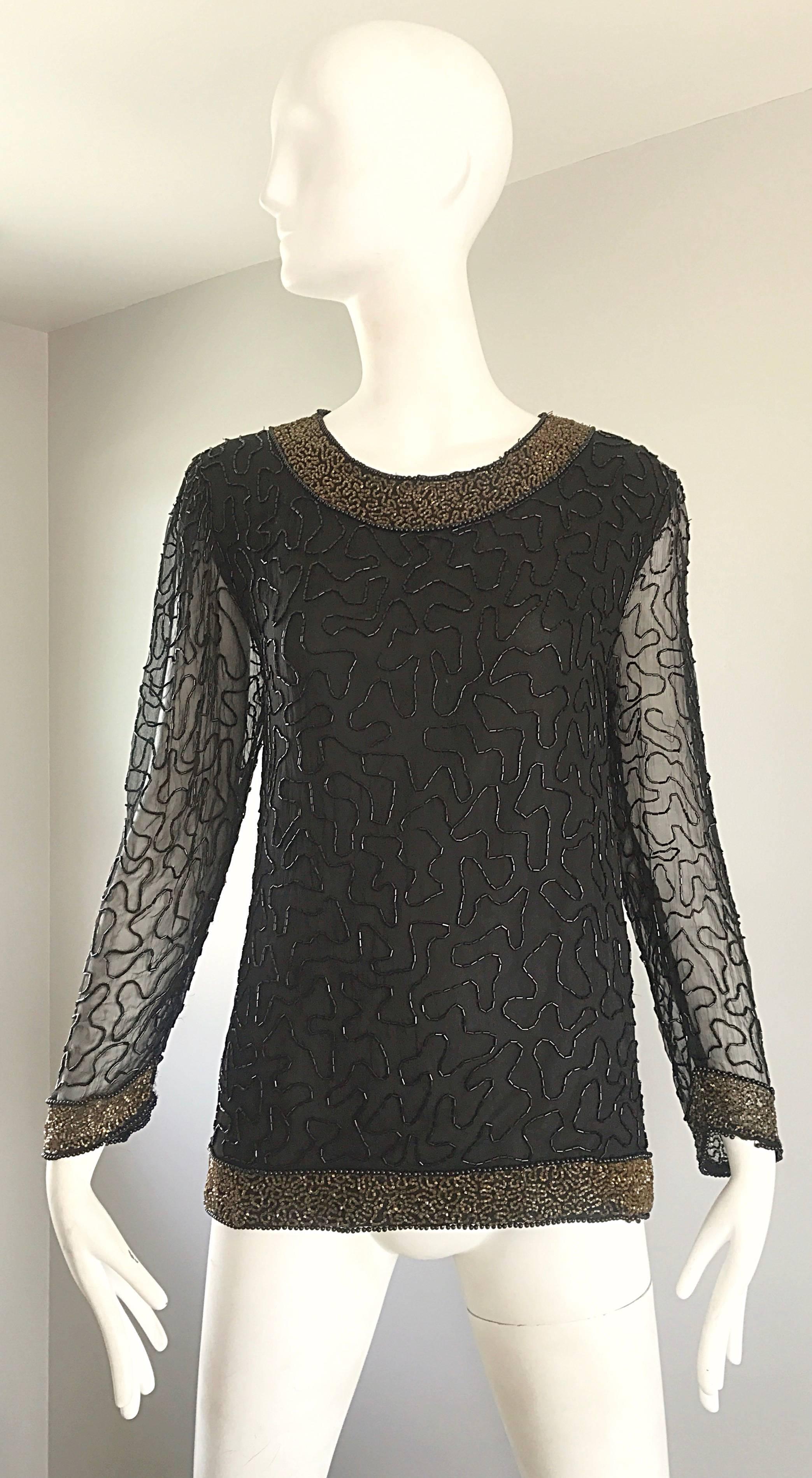 Stunning 1980s SWEE LO black and gold hand beaded silk chiffon long sleeve blouse! Wonderful tailored fit, with thousands of hand-sewn seed beads throughout. Neckline, sleeve cuffs, and waistband are all encrusted with goldseed beads. Semi sheer