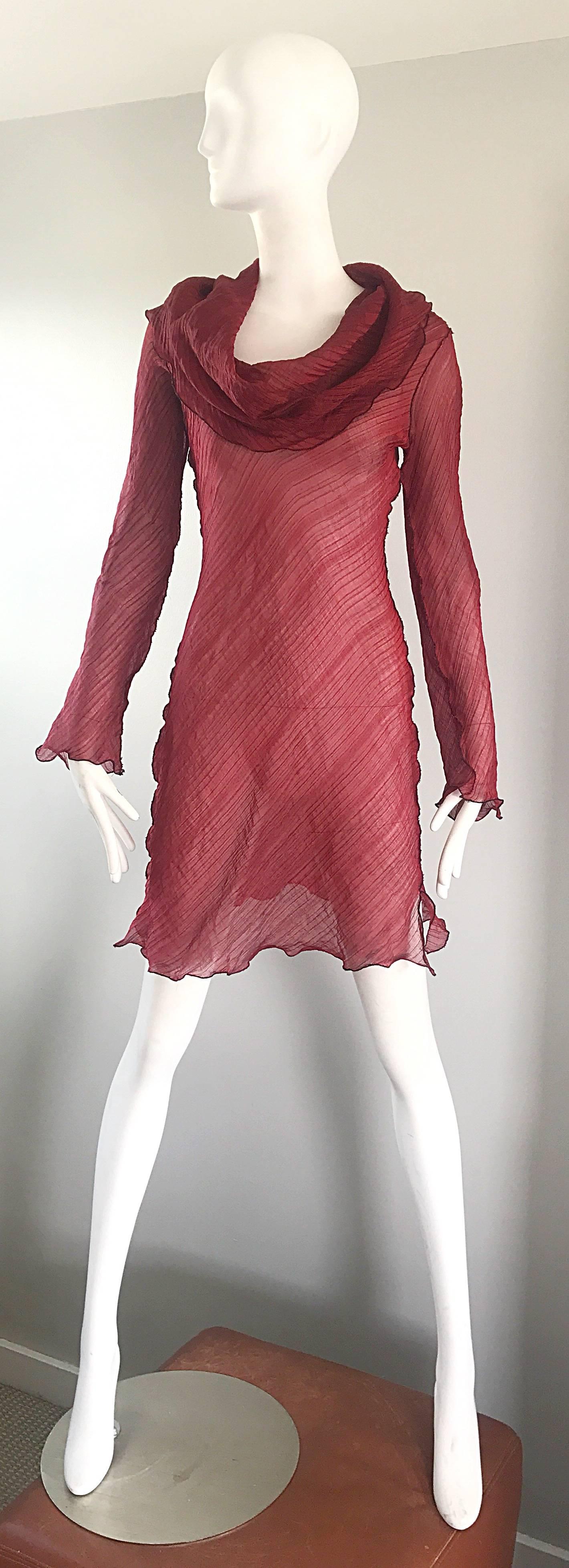 Chic legendary CARI BORJA ( see link ) red cowl neck silk and rayon blend tunic dress! Simply slips over the head. Vents at each side of the hem. Soft luxurious pleated fabric is light and airy, and stretches to fit. Great and easy piece to pack for