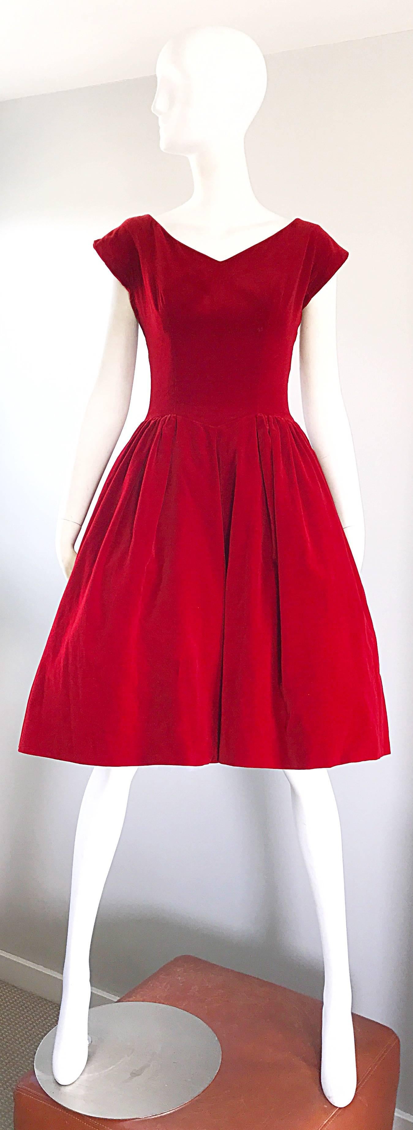 Stunning 1950s LORRIE DEB red velvet fit and flare dress! This beauty has so much going on for it! Fitted bodice, with a flattering full skirt that could easy accomodate a crinoline / petticoat underneath for added volume. Full metal zipper up the