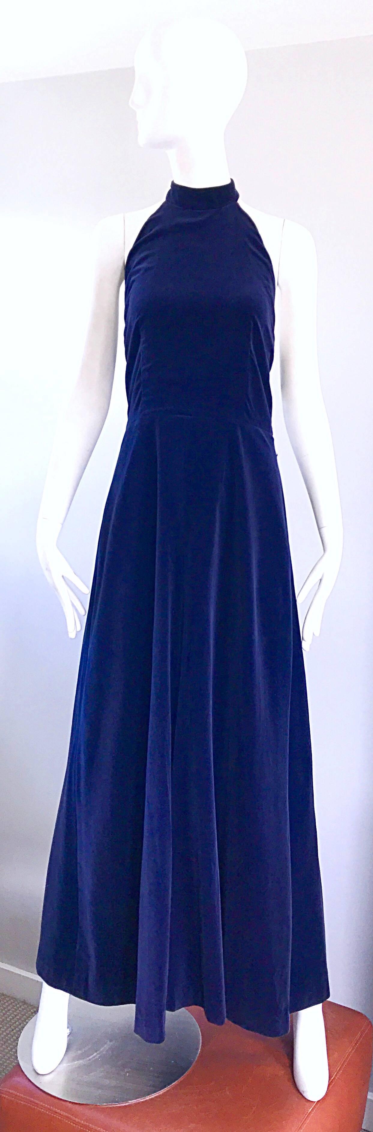 Brilliant 1970s YVES SAINT LAURENT 'Rive Gauche' navy blue velvet halter maxi dress / gown! Features a fitted bodice, with a flattering and forgiving full skirt. Hidden zipper up the back with hidden hook-and-eye closures at top back neck. Fully