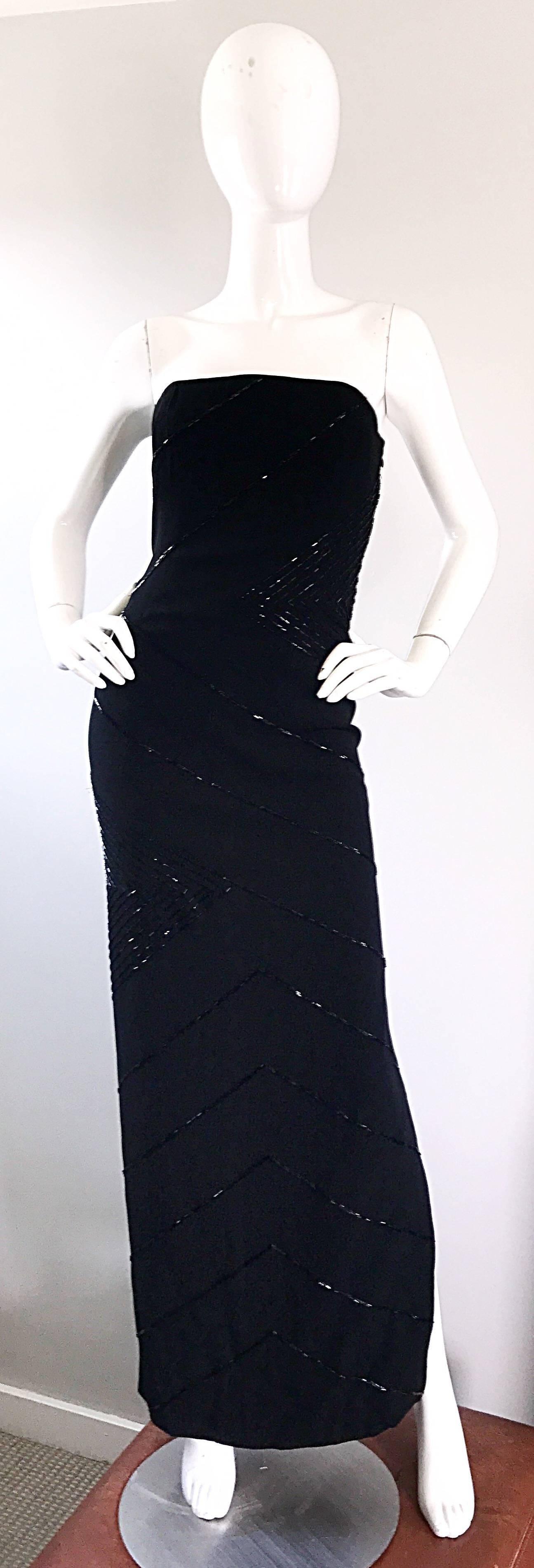 Stunning 1990s BILL BLASS black crepe beaded strapless evening gown! Features thousands of slimming black beads hand-sewn throughout. Interior boned bust helps keep everything in place, along with interior waist support. Hidden zipper up the side