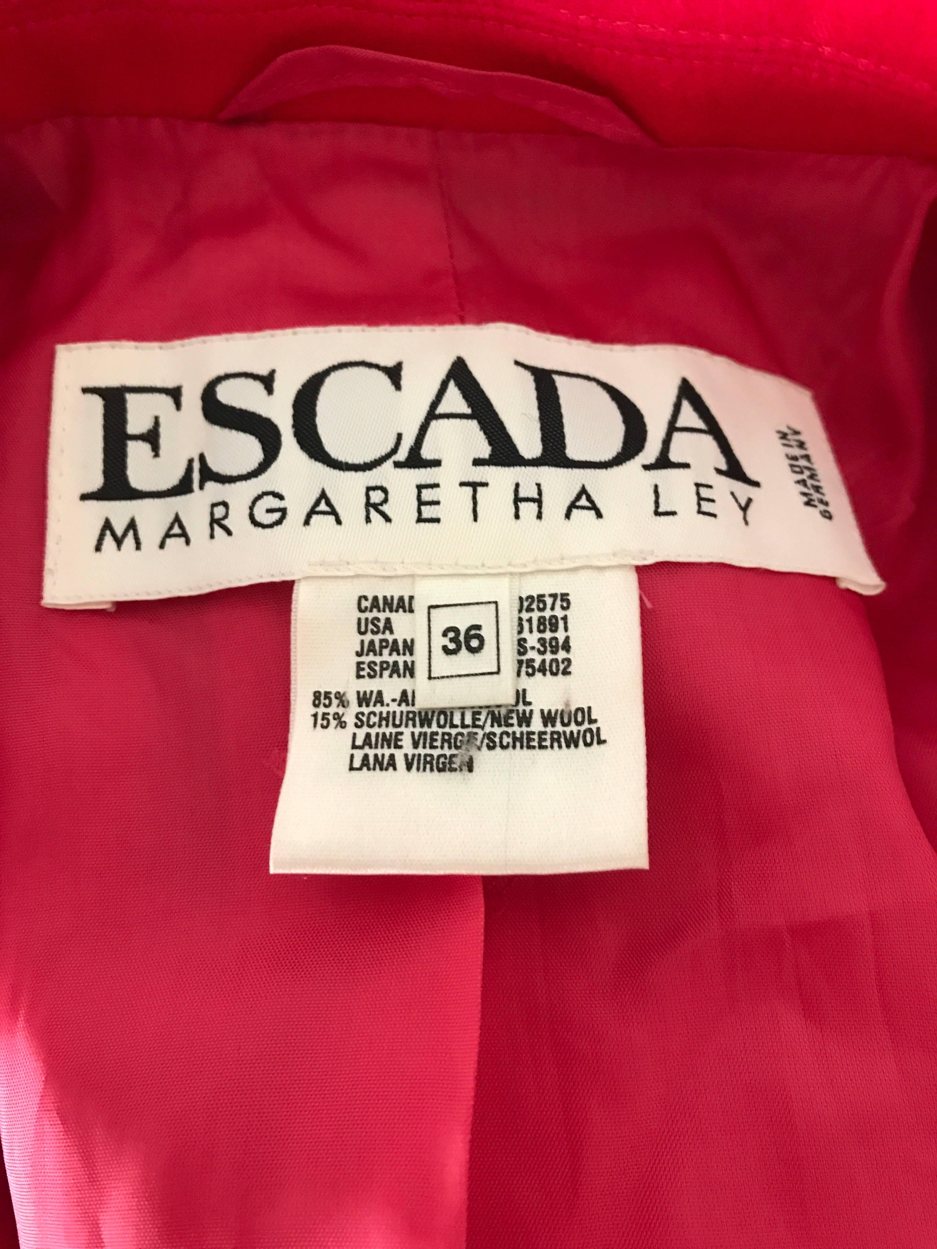 Make a statement in this 1990s ESCADA by MARGARETHA LEY shocking hot pink Angora wool jacket! Features a singular gold Escada embossed button at natural waist, and three down each sleeve cuff. Amazingingly soft angora wool blend (85% Angora, 15%