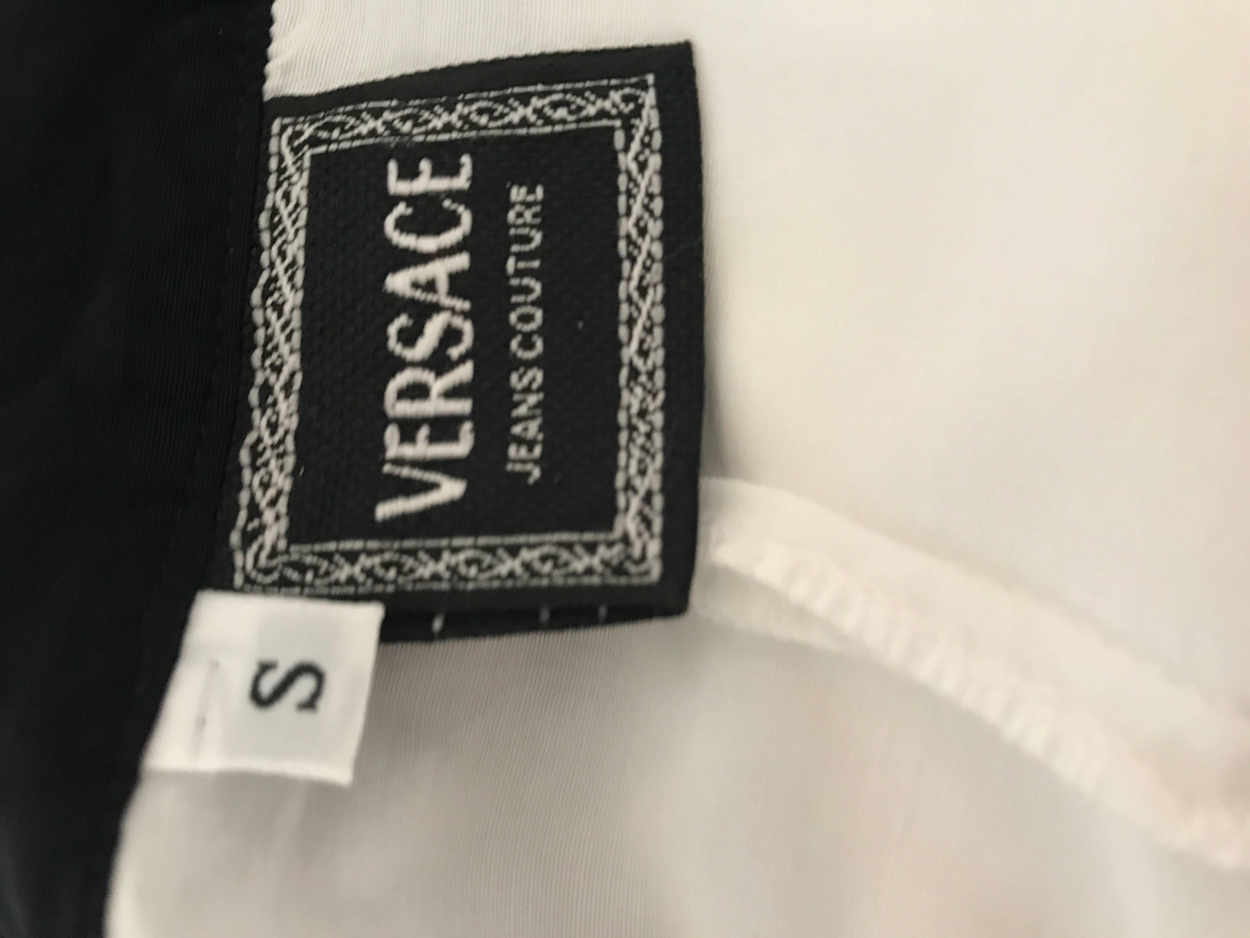 Rare 1990s GIANNI VERSACE black and white long sleeve fitted rayon and silk blended shirt! Features a sleek tailored fit. Long fitted sleeves, with flamenco style cuffs, which are layers of black and white polka dots, gingham plaid, and pindot