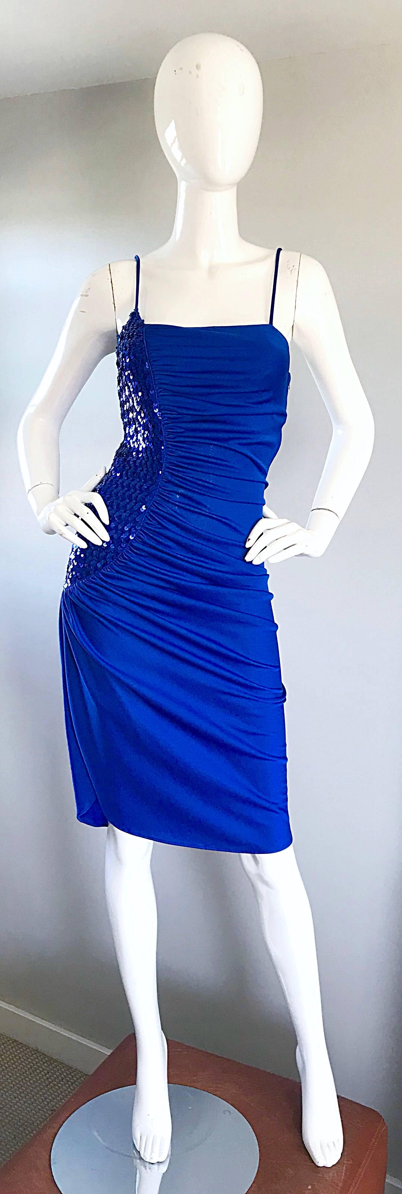 Sexy early 1980s SAMIR royal blue jersey and sequined Studio 54 disco dress! Features a slinky jersey fabric with hundreds of hand-sewn sequins on the right side. Hidden zipper up the side. Stretches to fit. Insanely flattering, and a definite head