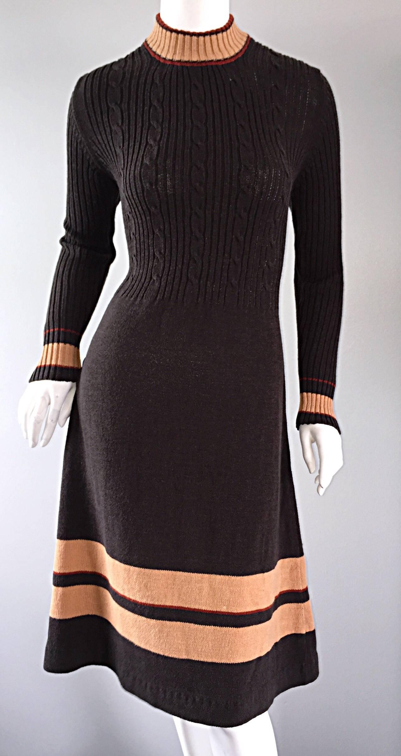 Chic 60s Judy Wayne 60s sweater dress! Ribbed, with camel and maroon stripes at collar, hem, and cuffs. A-Line shape makes for a very flattering look. Tailored long sleeves, with hidden zipper in back. Easily transitions from day to night. Great