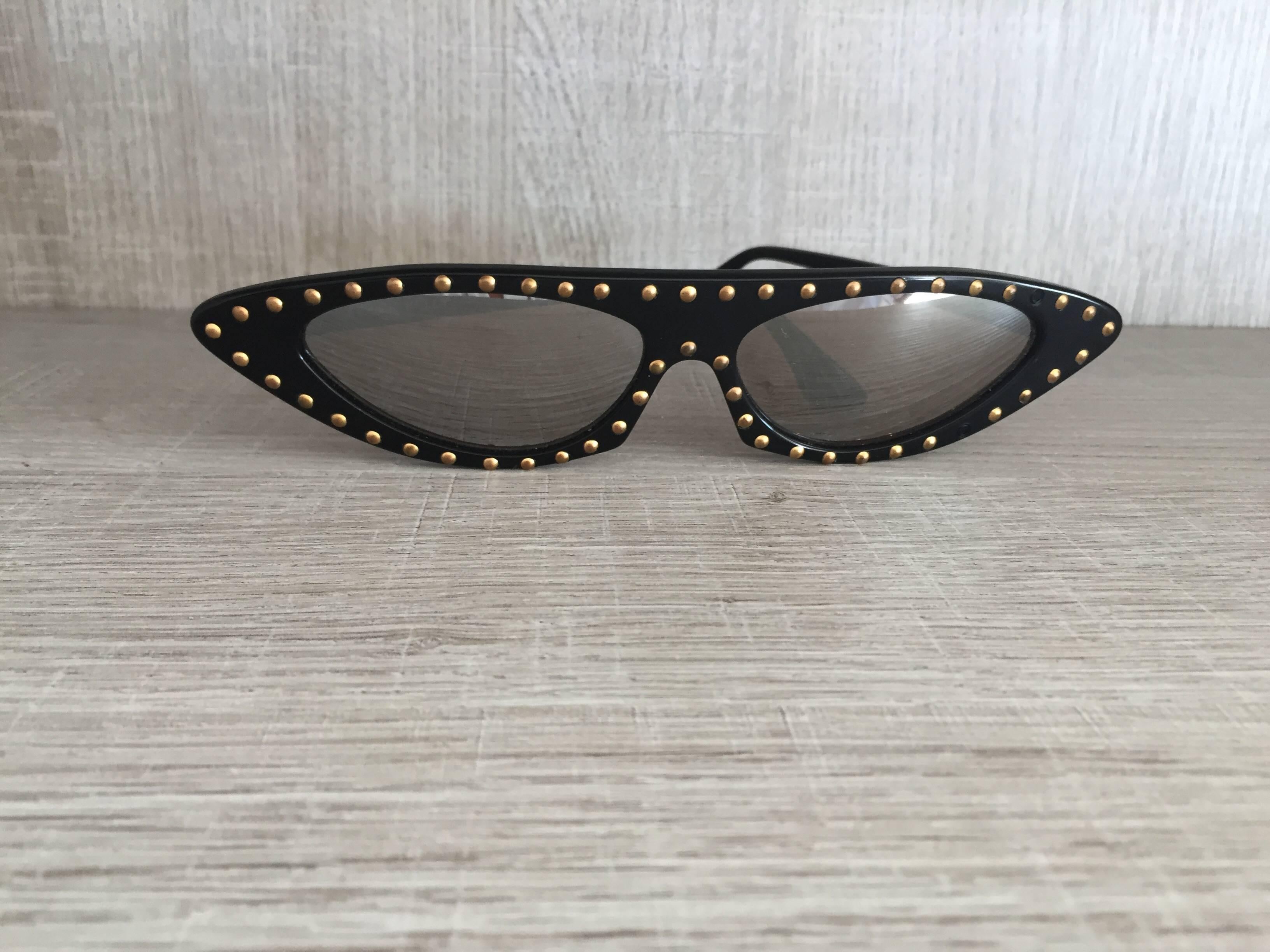 Extremely RARE vintage Patrick Kelly cat eye sunglasses! Encrusted with studs around frames. Patrick Kelly's career was cut short by his untimely death, making his pieces incredibley rare, and super hard to come by! I have a handfull of his dresses