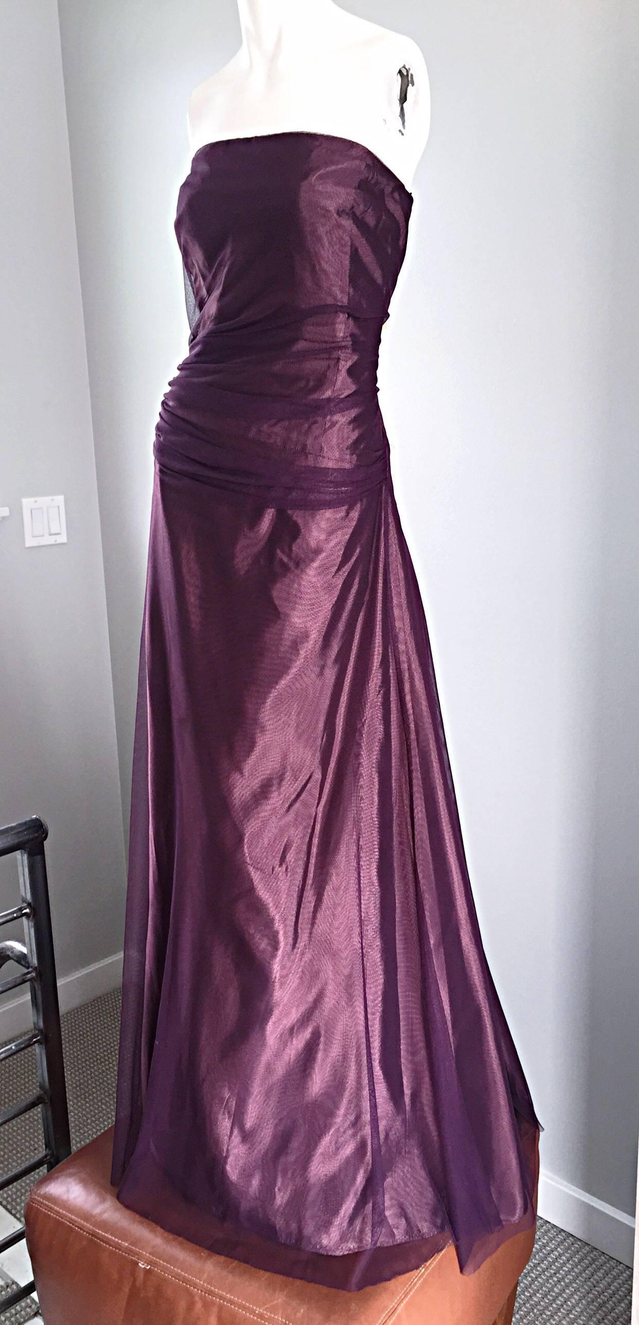 Stunning Vera Wang purple / eggplant Taffetta evening ball gown! From the early to mid 1990s. Extremely flattering to the shape. Layers and layers of tulle over taffeta. Ruching at waist makes for an extra slimming effect. This strapless gown is