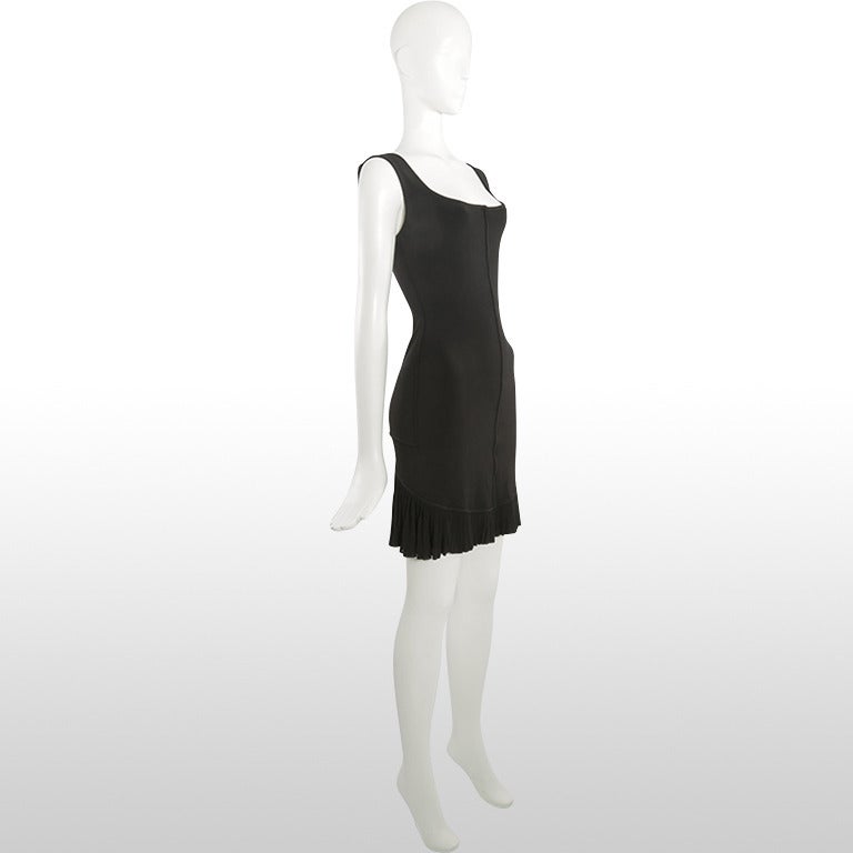 This gorgeous late 1980’s/early 1990’s black number by Alaia is the iconic body-con style that the designer is known for. It’s figure forming shape sculpts the body and hugs at the waist and hips, it has a now scooped neckline and low back.