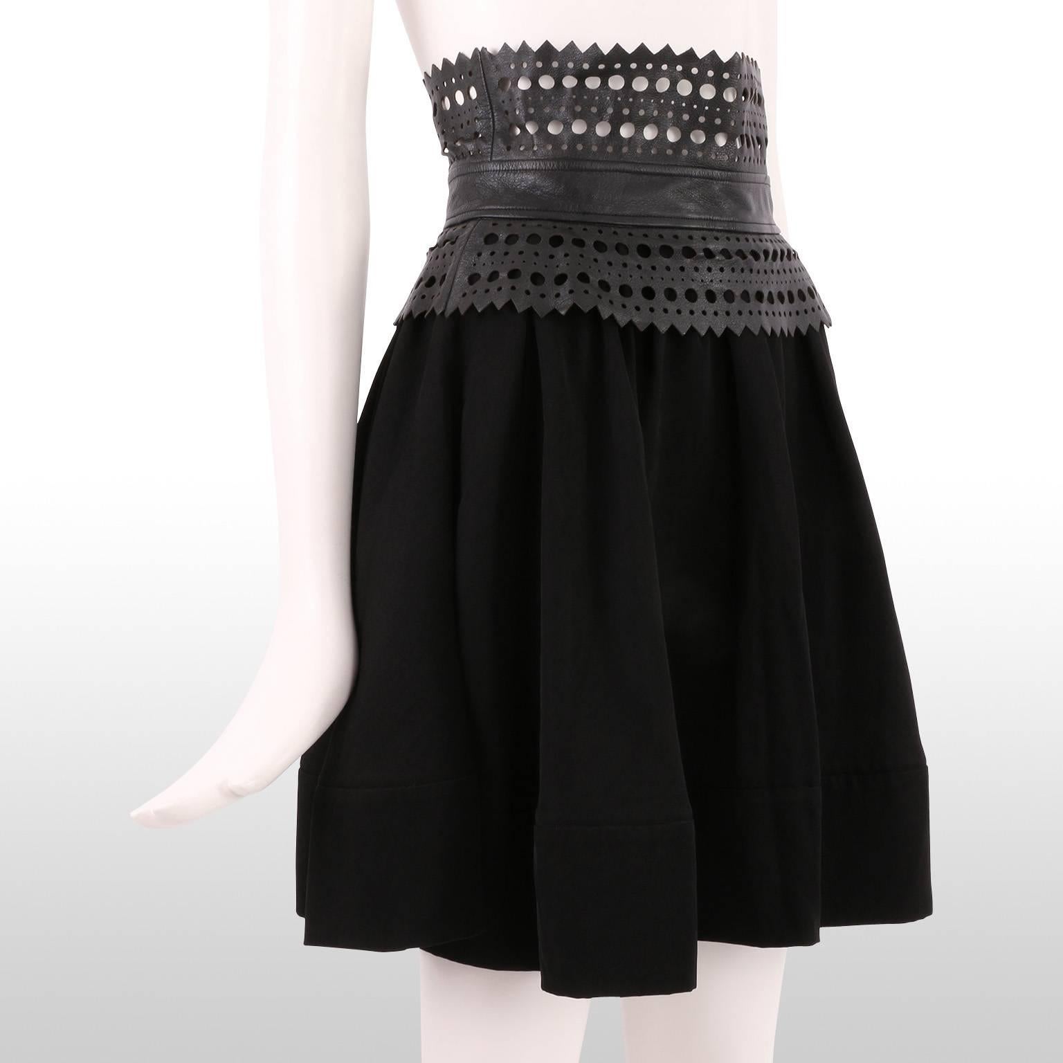 Founded in 2007 by Mary Kate and Ashley Olsen, the Elizabeth and James fashion line is all about laid back glamour. This skater skirt brings the drama with is flouncy design and laser cut leather waistband. It is in excellent condition. 