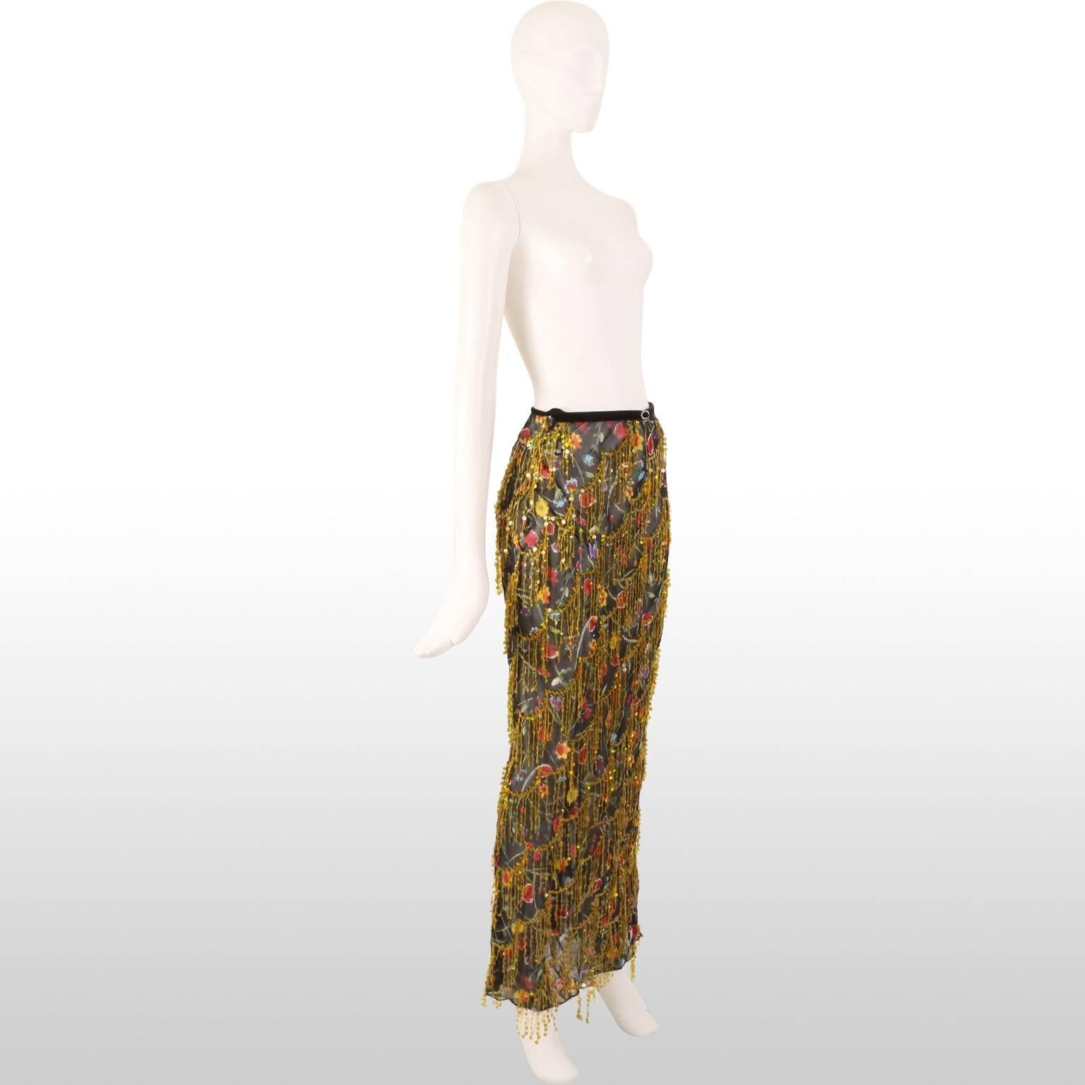 This original Voyage skirt features in there couture collection and is highly embellished with stunning details. The skirt is made of a lightweight sheer fabric in a dark floral design in tones of crimson and violet creating a bold contrast with the