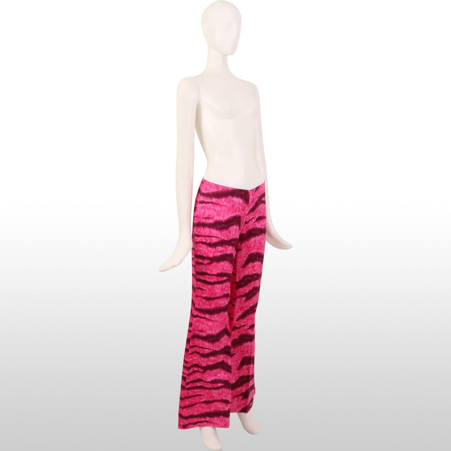 Fun and fabulous Moschino kick flare vibrant fuchsia pink tiger print trousers from the Spring Summer 2000 collection. Sassy and daring, these trousers are a bold fashion statement and a great play on the recent kick flare trend, and ideal for those