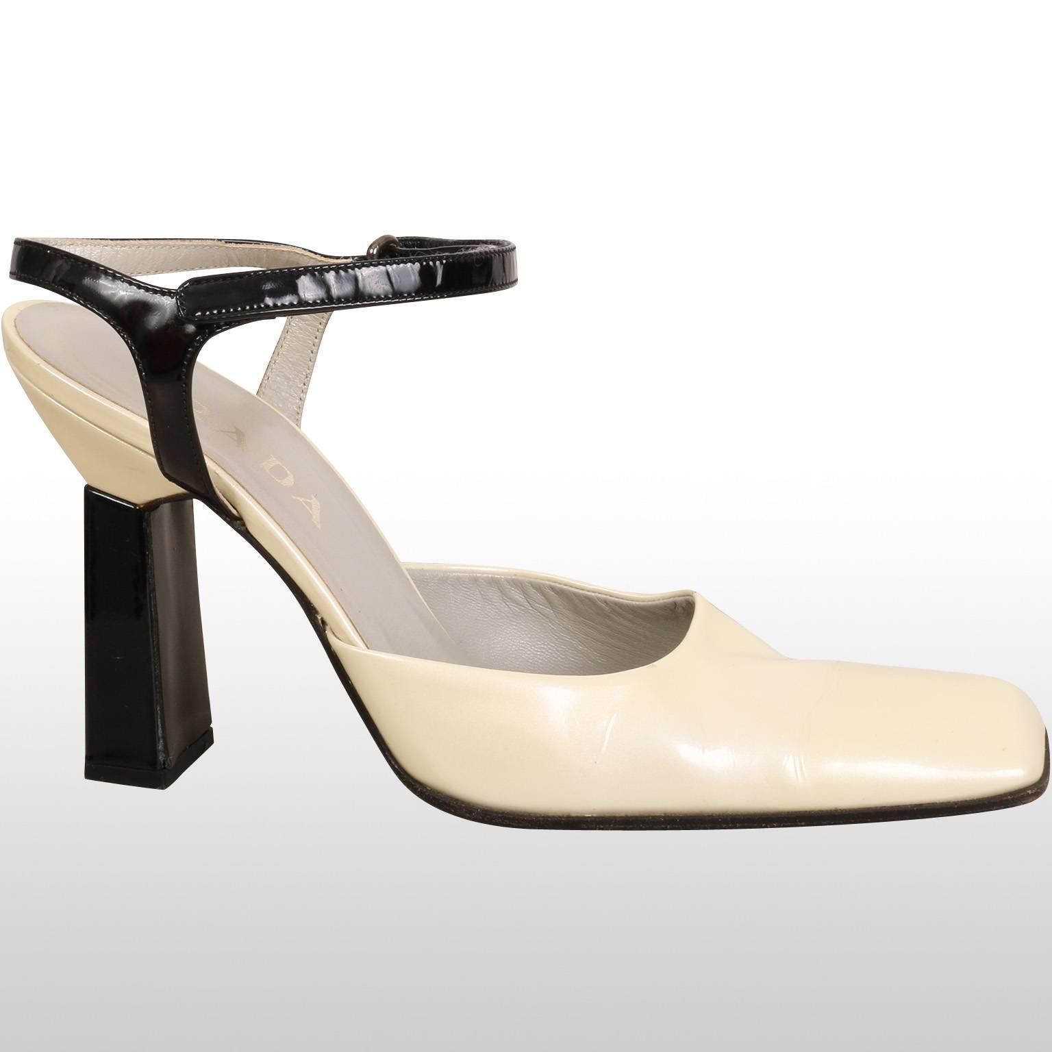 Beautiful staple Prada high heel sandal from the Autumn Winter 2001/02 runway collection. The shoe features a monochrome feel with block heel and squared toe. Elegant and timeless, the shoes can be worn on a day out in the city, for a luncheon or a