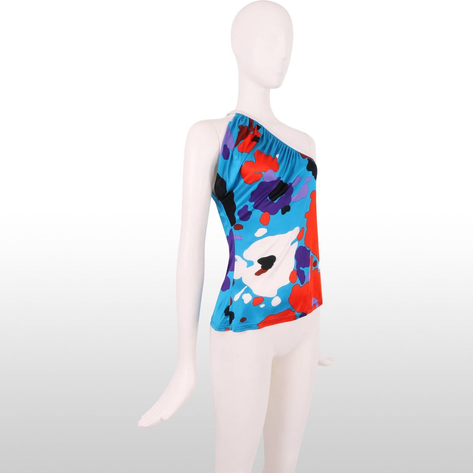 This fun John Galliano one shoulder top has abstract floral prints over a bright electric blue background. The piece drapes beautifully across the bust at a flattering angle and is therefore easy and comfortable to wear. Sexy and quirky, this top