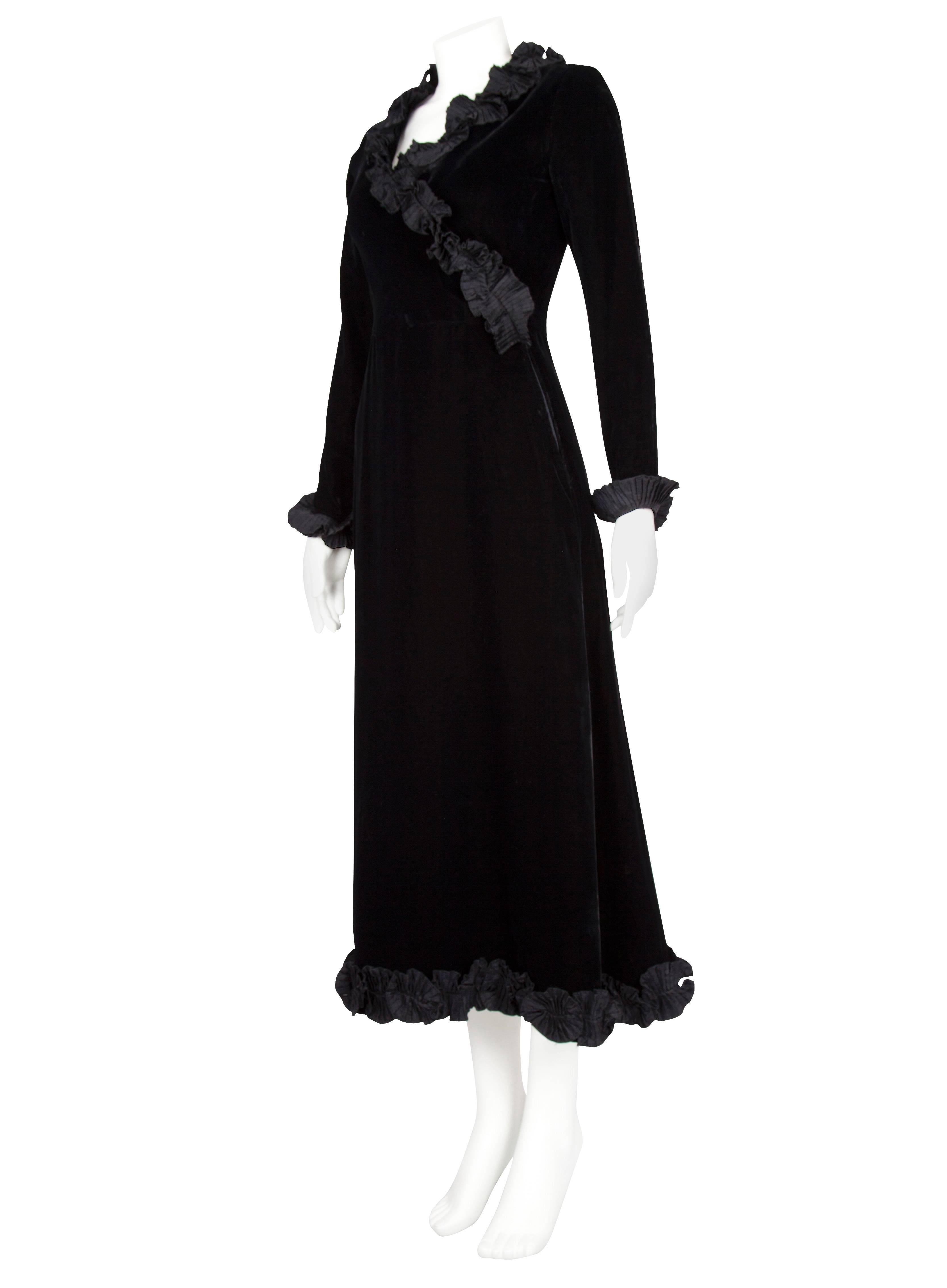 A classic Yves Saint Laurent Rive Gauche evening dress with a wrap around bodice embellished with a micro-pleated taffeta trim which goes all around the collar. The cuffs are fitted with the aid of a small zip, and are also trimmed with the pleated