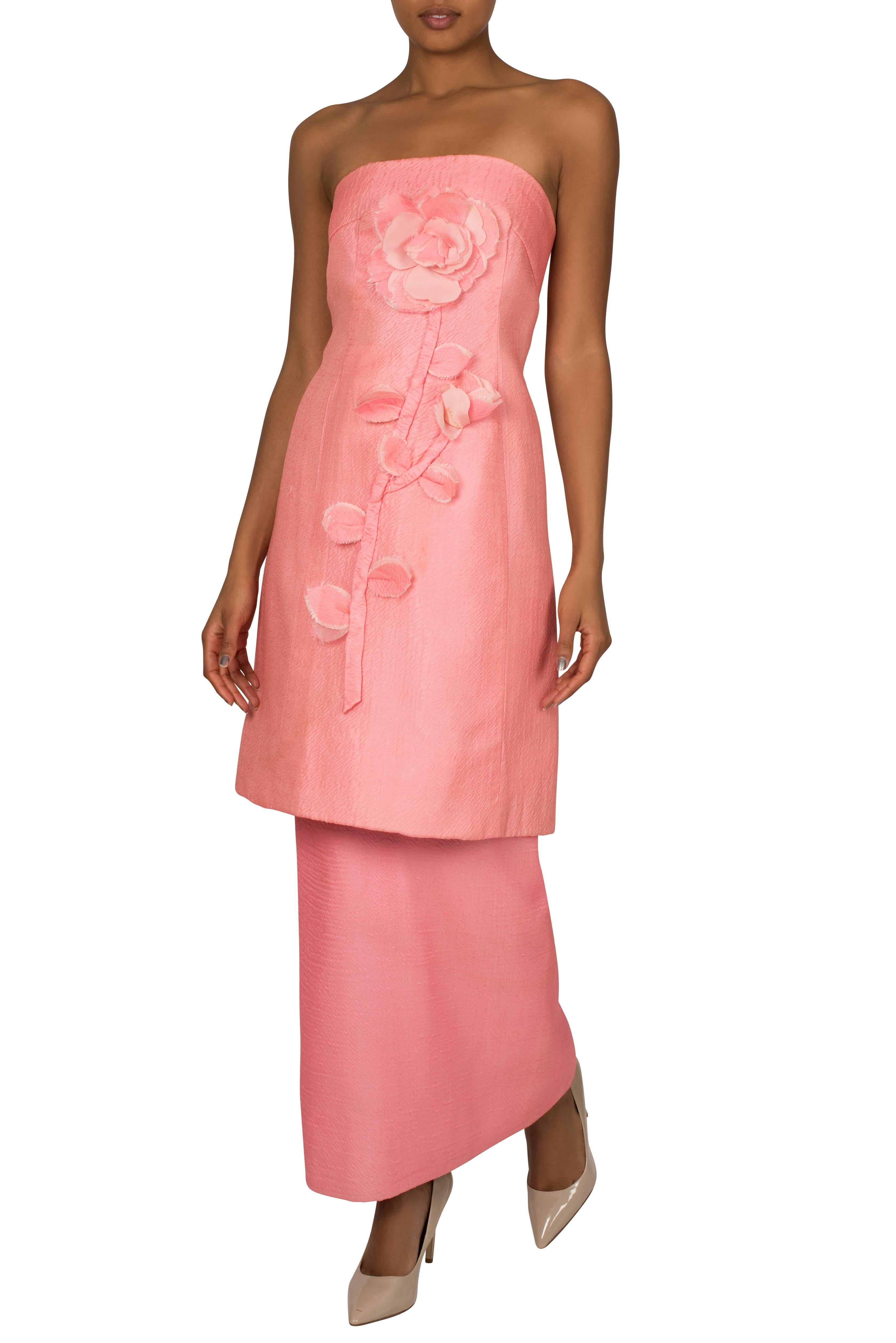 A short strapless rose pink cocktail dress by London society couturier Harald which includes an optional underskirt in order to transform it into a tiered full-length gown. Constructed from a textured polyester chiffon with a slight sheen, the