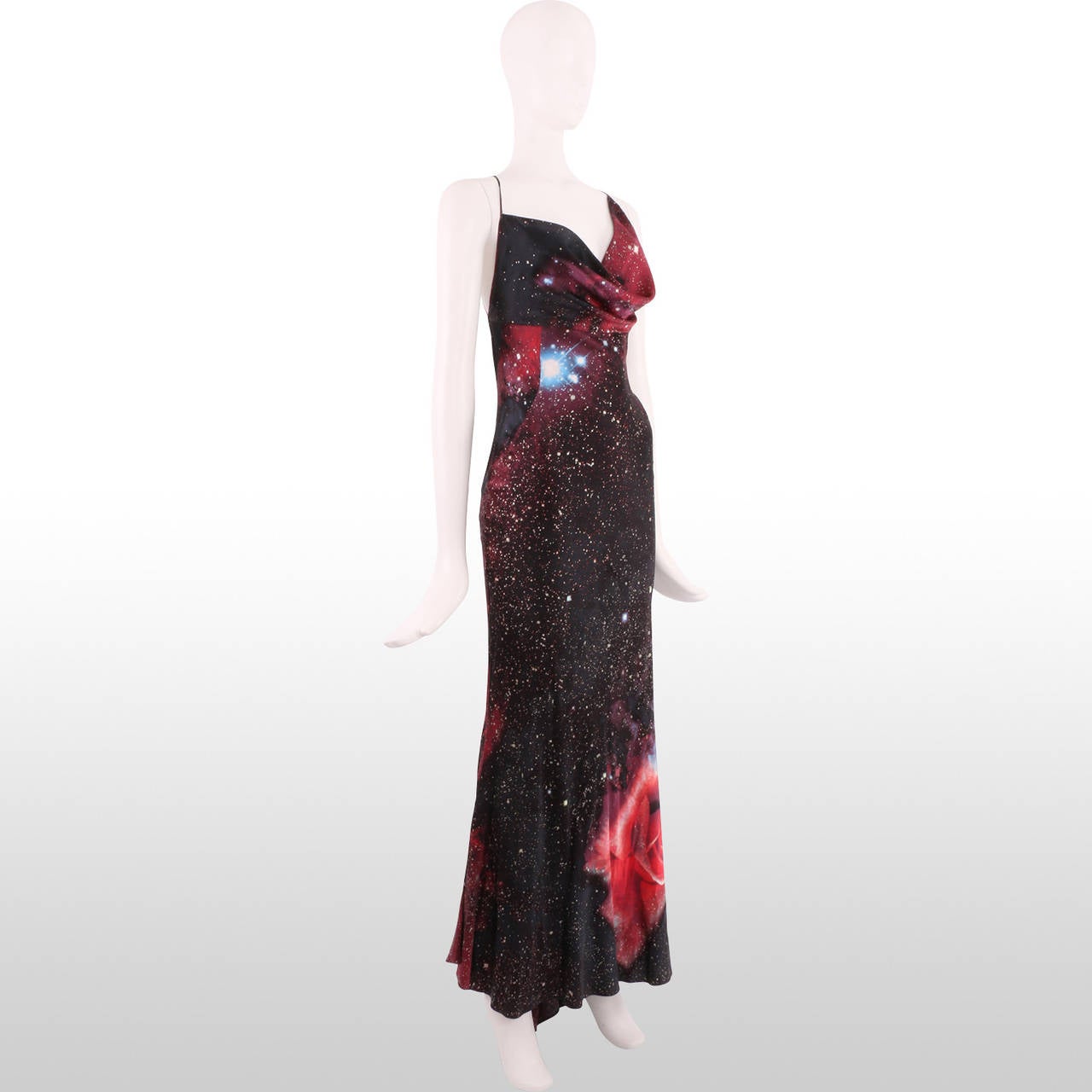 This gown's striking prints are Cavalli's interpretation of heavenly bodies. Galactic swirls of stars and planets with cosmic roses thrown in for quirkiness.  The silk satin feels slinky on the body and drapes beautifully. The back of the gown