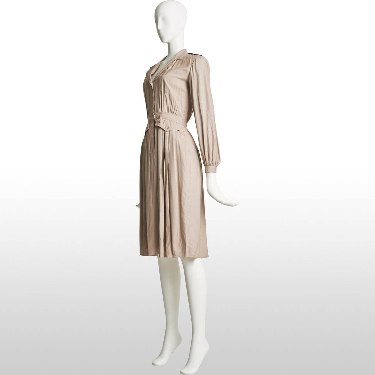 This is a elegant ivory silk day dress by Pierre Cardin from the 80's that has pleats and various pockets. Can be beautifully combined with a oversize long knitted cardigan and books. Remains in excellent condition.