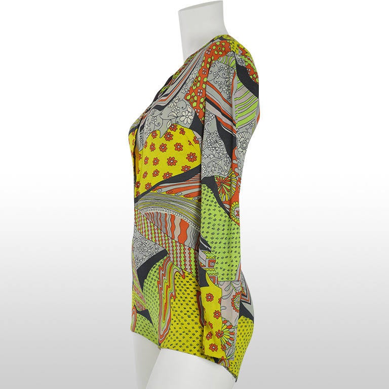 This amazing rare body suit by Donald Brooks for Sinclair is a unique addition to the wardrobe. It is made from a figure hugging synthetic jersey fabric and depicts an abstract psychedelic floral and pattern print in autumnal brown, grey, green and