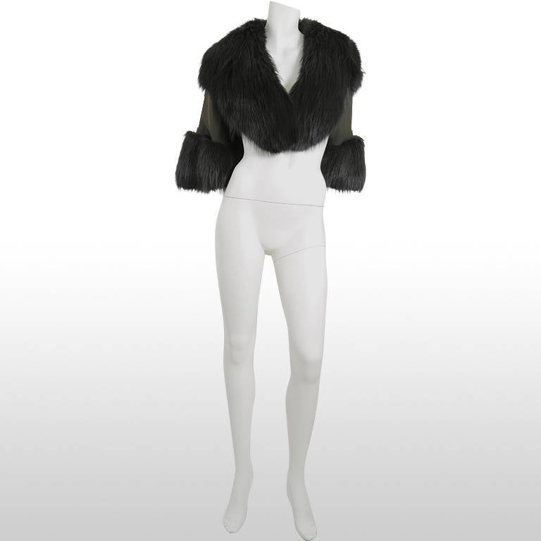This fantastic black fox fur trimmed cape is from the 1940’s, it oozes elegance with its beautiful large fur collar and over-sized cuffs. It is a cropped cape with ¾ length sleeves. This garment was originally from the Jordan Marsh department store