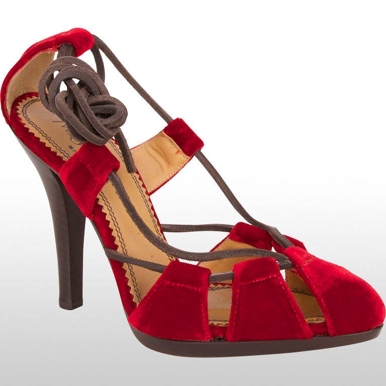 This fantastic Yves Saint Laurent heels are made from ruby red velvet and fasten with a lace that also becomes part of the design of the shoe. These shoes have a 4.5
