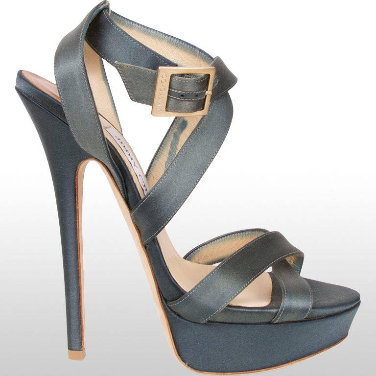 These gorgeous teal satin Jimmy Choo heels are from our future vintage collection. They fasten with a buckle at the ankle and have a cross-over sandal design. These shoes have a 1