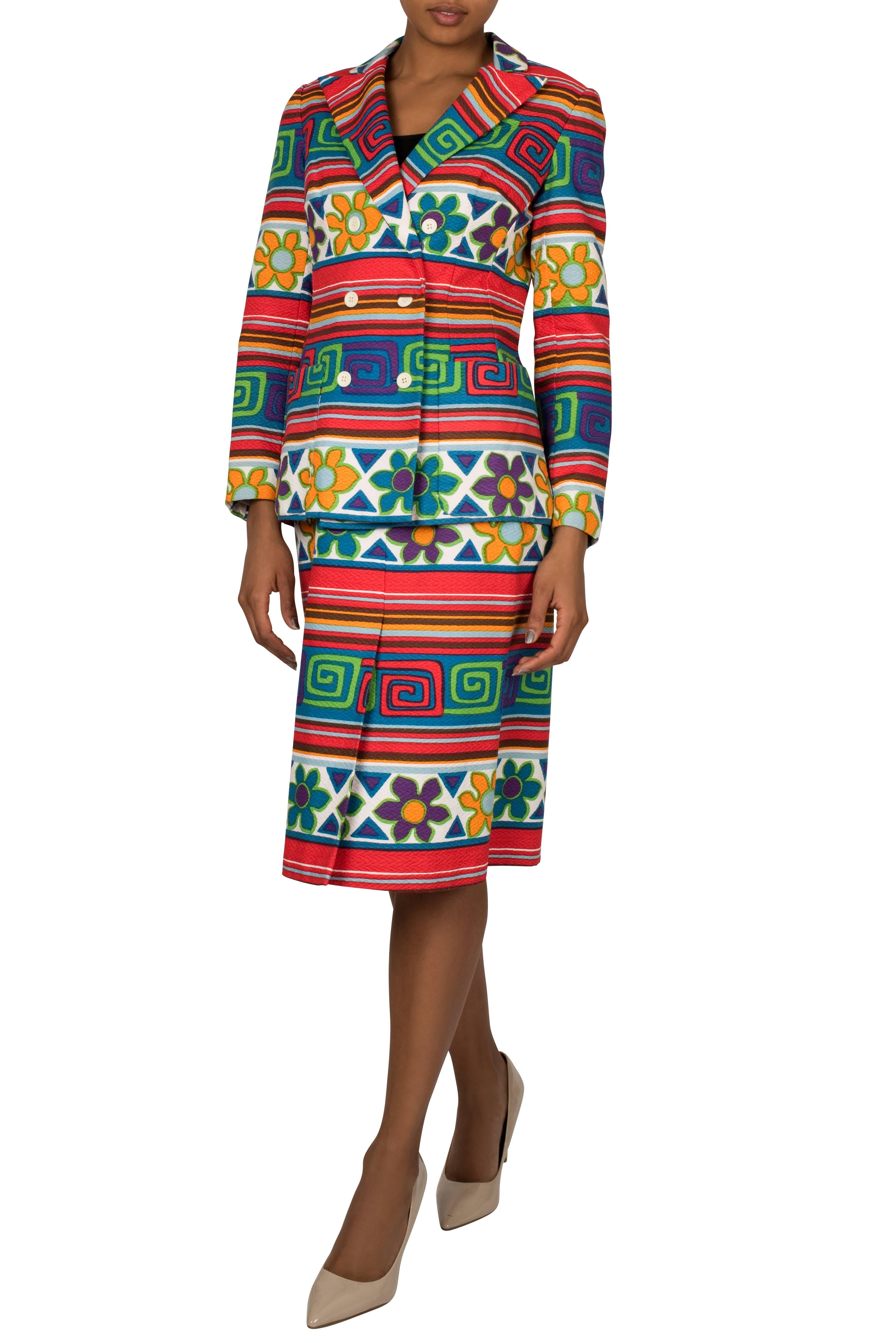 Bright coloured 1970's patterned skirt suit by Lanvin. Made from a textured cotton fabric, this cleverly constructed ensemble features a double breasted jacket with darts on the shoulders for optimal fitting. It also has and two snap buttons inside,