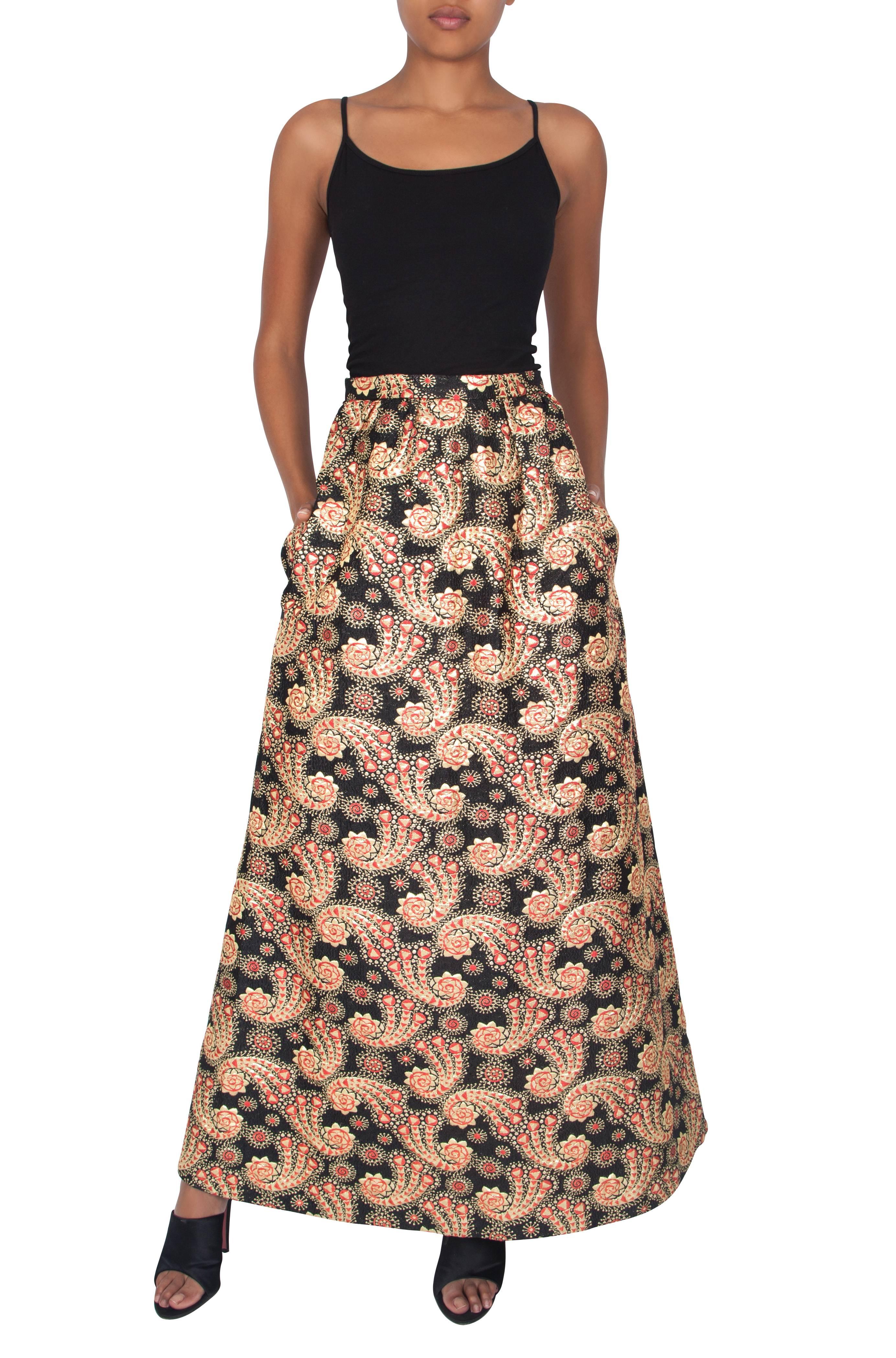 We love this beautiful Hardy Amies piece from the 1960's. It is an amazing skirt for a special occasion with its intricate brocade fabric forming a paisley pattern in tones of shimmering gold, black and hot magenta. It also features pockets hidden