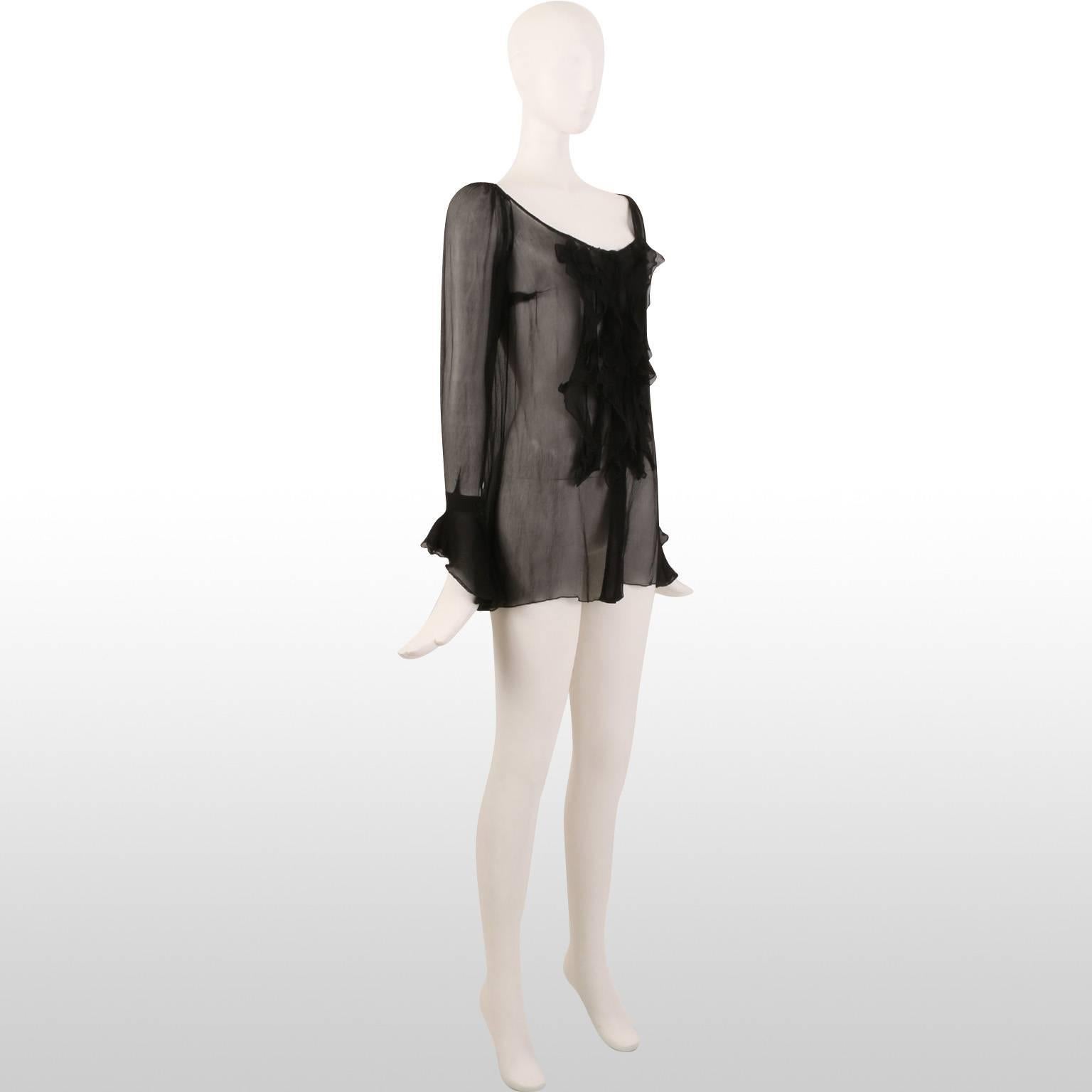 This romantic sheer Blumarine black chiffon top combines romance and allure all in one. Delicate ruffles cascade down the middle of the top and they also feature of the sleeve cuffs.  It is a blouse which can be worn dressed up or down and it will