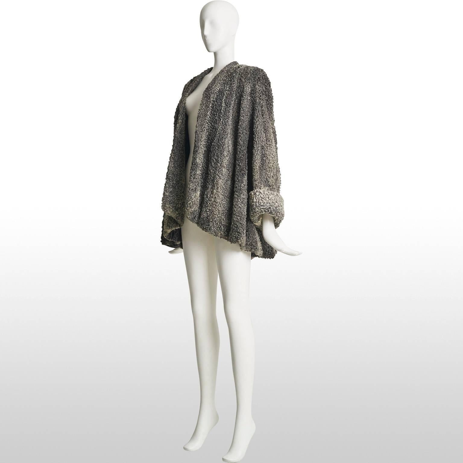 This is an amazing swing coat from the 40s, made out of astrakhan, which is a very high quality fur. The fur is optioned from very young Karakul lambs as only they have the black colour and soft, tightly wound coils of fur. Astrakhan has been used