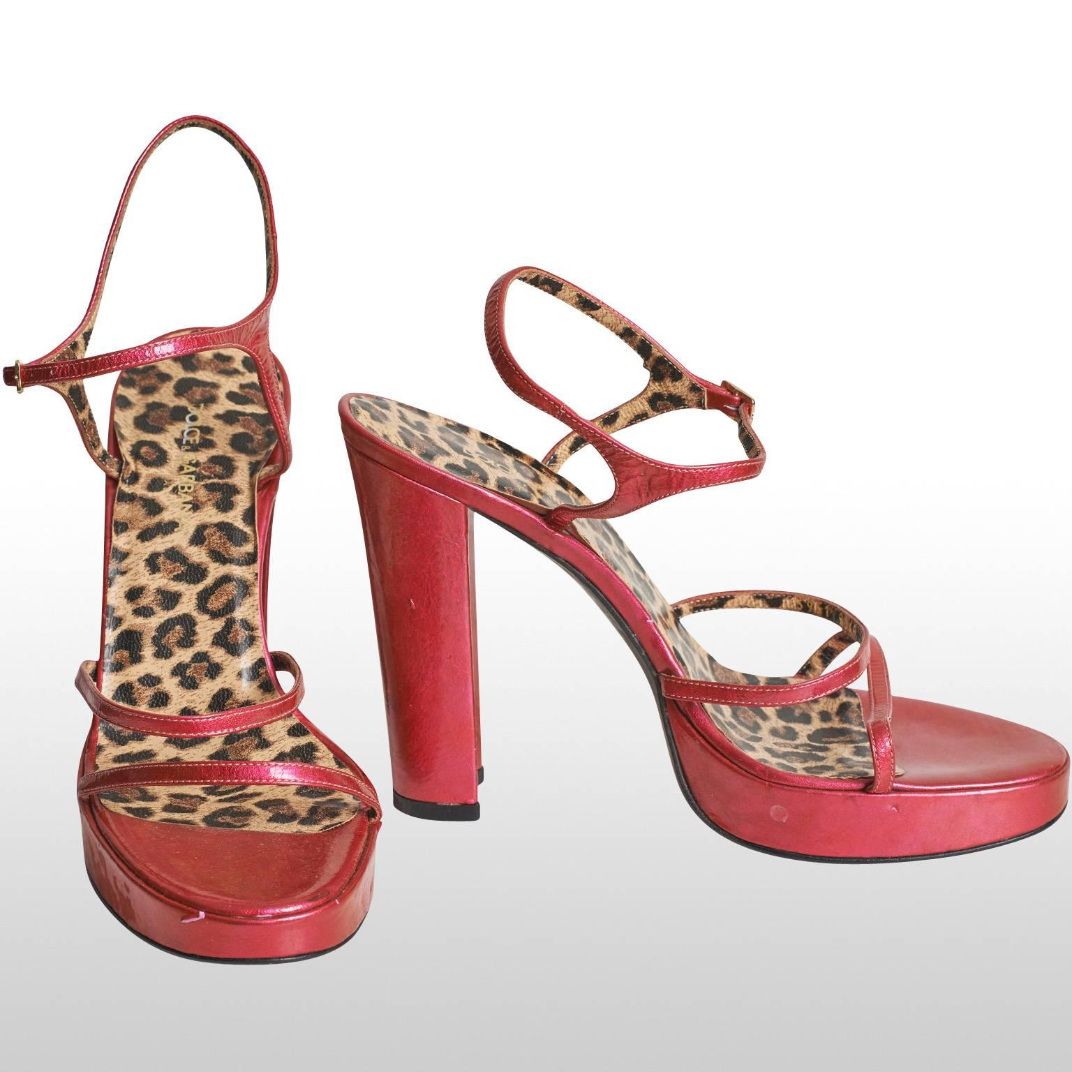 There D&G fushia high heel sandals have a 4.5 inch heel which includes the platform which is one inch tall. The insole of the sandal has a leopard print and overall the piece remains in excellent condition.