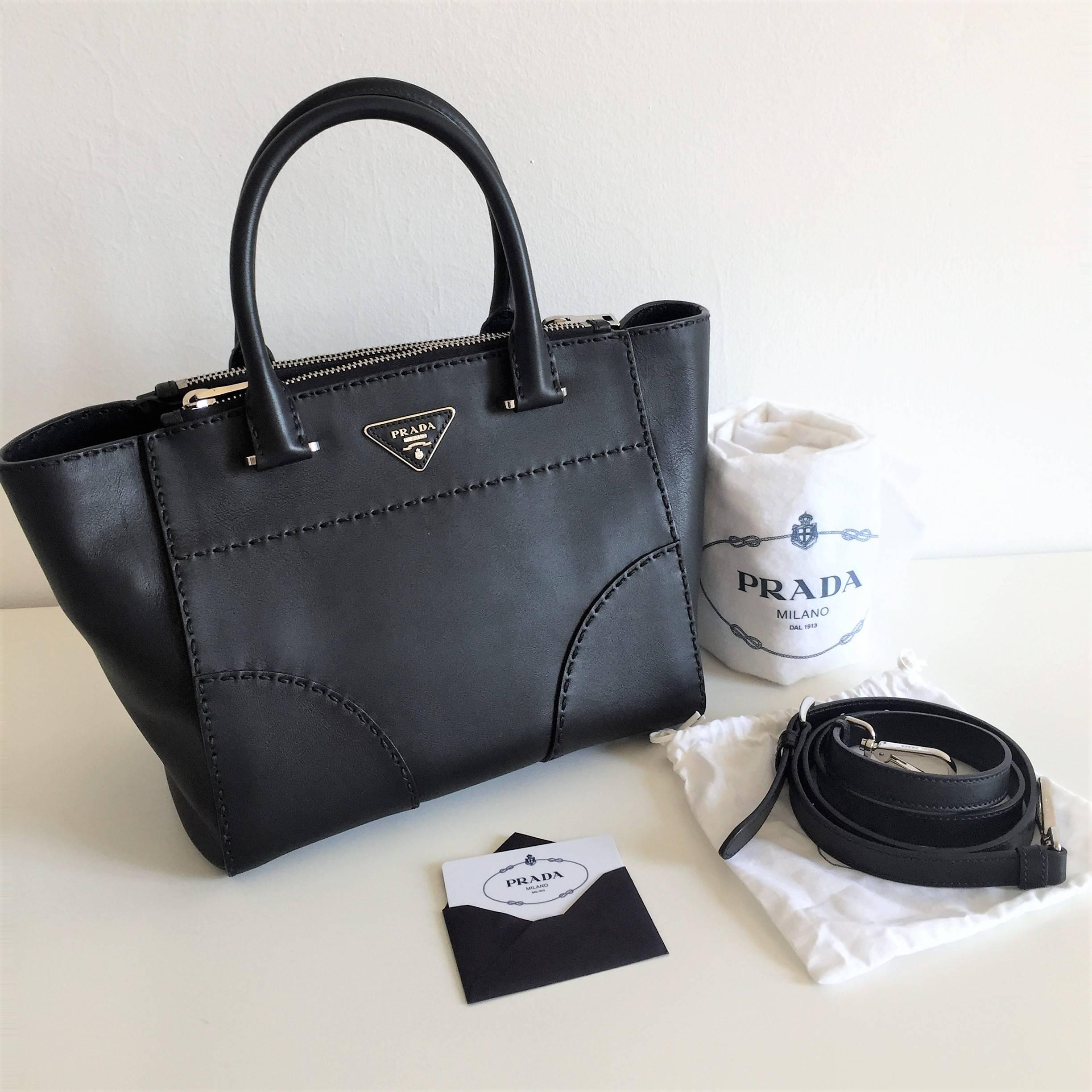 This Prada tote is made in black leather and can be worn in all occasions. Comes with all its original accessories and it's in pristine condition.
Condition: pre-loved in excellent condition like NEW
Material: Calf leather
Colour: Black.
Hardware: