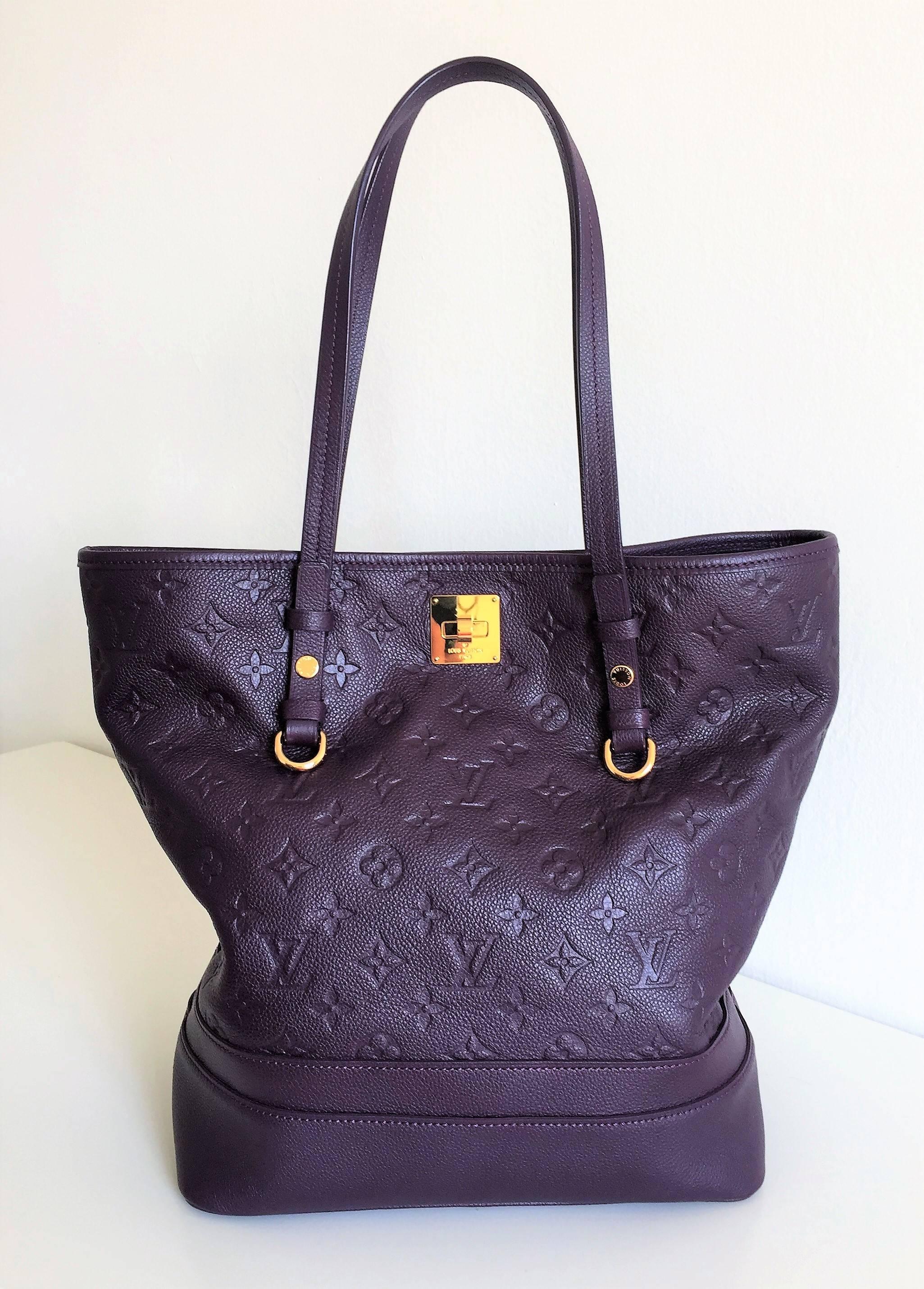This is a Louis Vuitton Citadines, a charming shoulder tote made in purple embossed Leather decorated with classic LV monogram 'empreinte' style, double handle, golden hardware, clasp closures, it comes with its original pochette and dust
