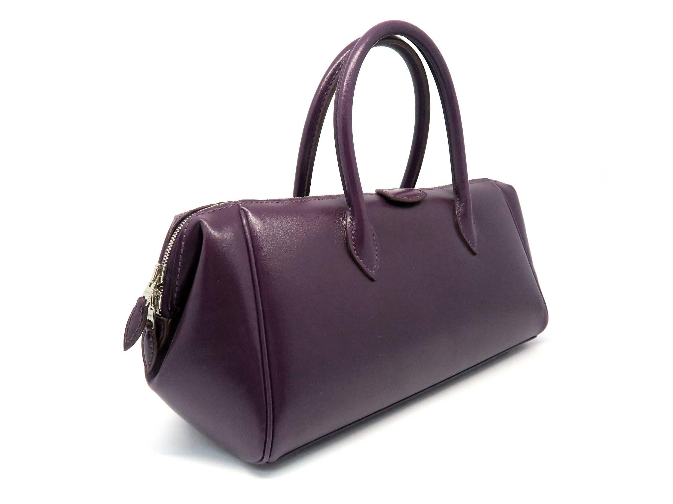 Color: Purple / Raisin (designer color)
Material: Box Calf Leather

Condition:
Rank A
Overall: Good, few minor defects
Surface: Good
Corners: Minor Scratches
Edges: Good
Handles/Straps: Good
Hardware: Minor Scratches

Dimensions: 
W30 x H14 x D9.5cm
